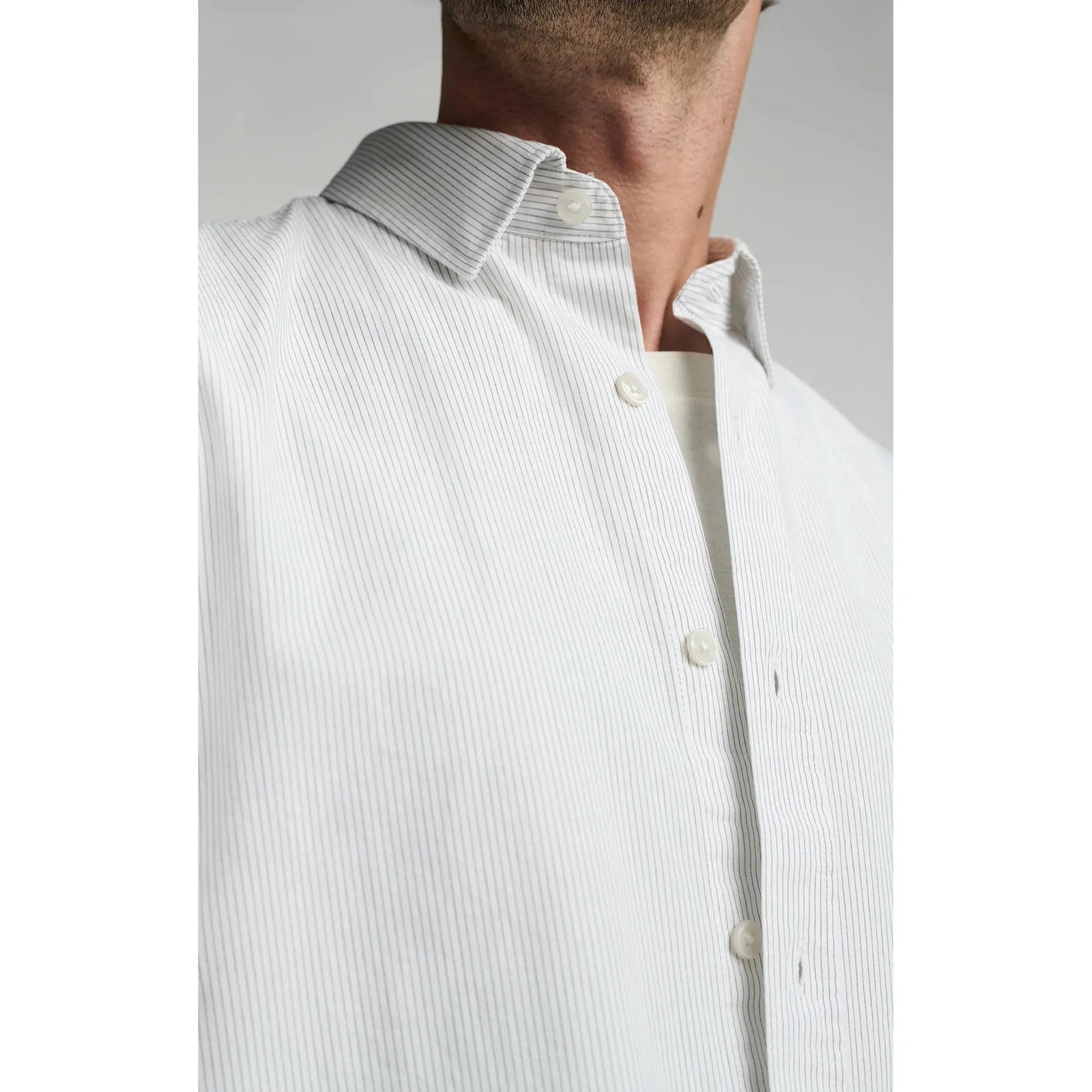 Elevate your style with the Mavi Long Sleeve Button Up Shirt, featuring subtle stripes for a polished look.