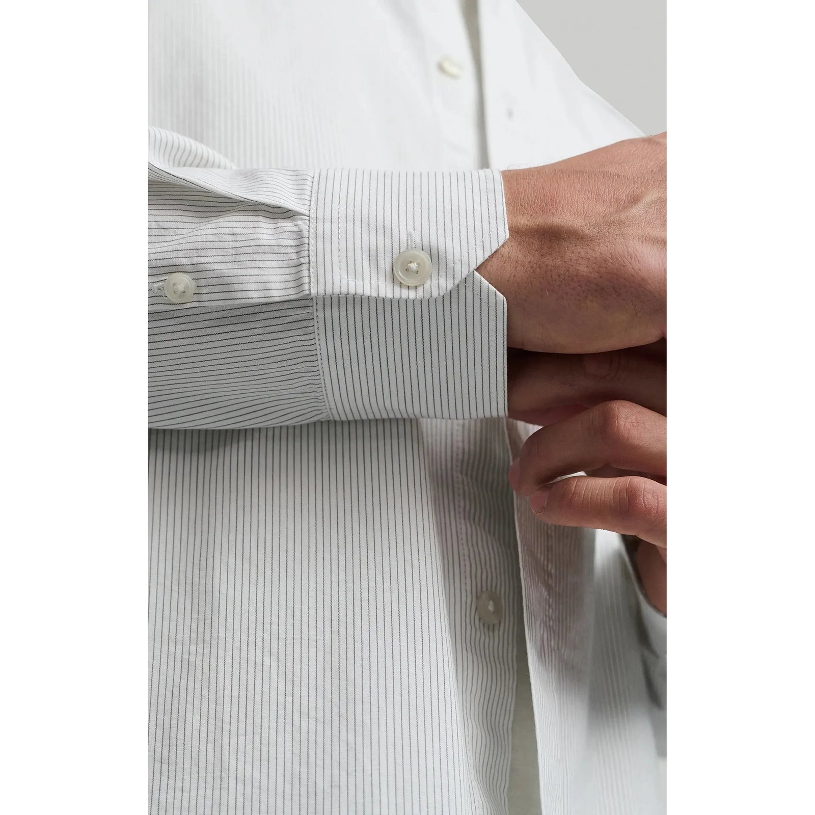 Mavi Long Sleeve Button Up Shirt features crisp white cotton with subtle stripes, perfect for versatile styling.