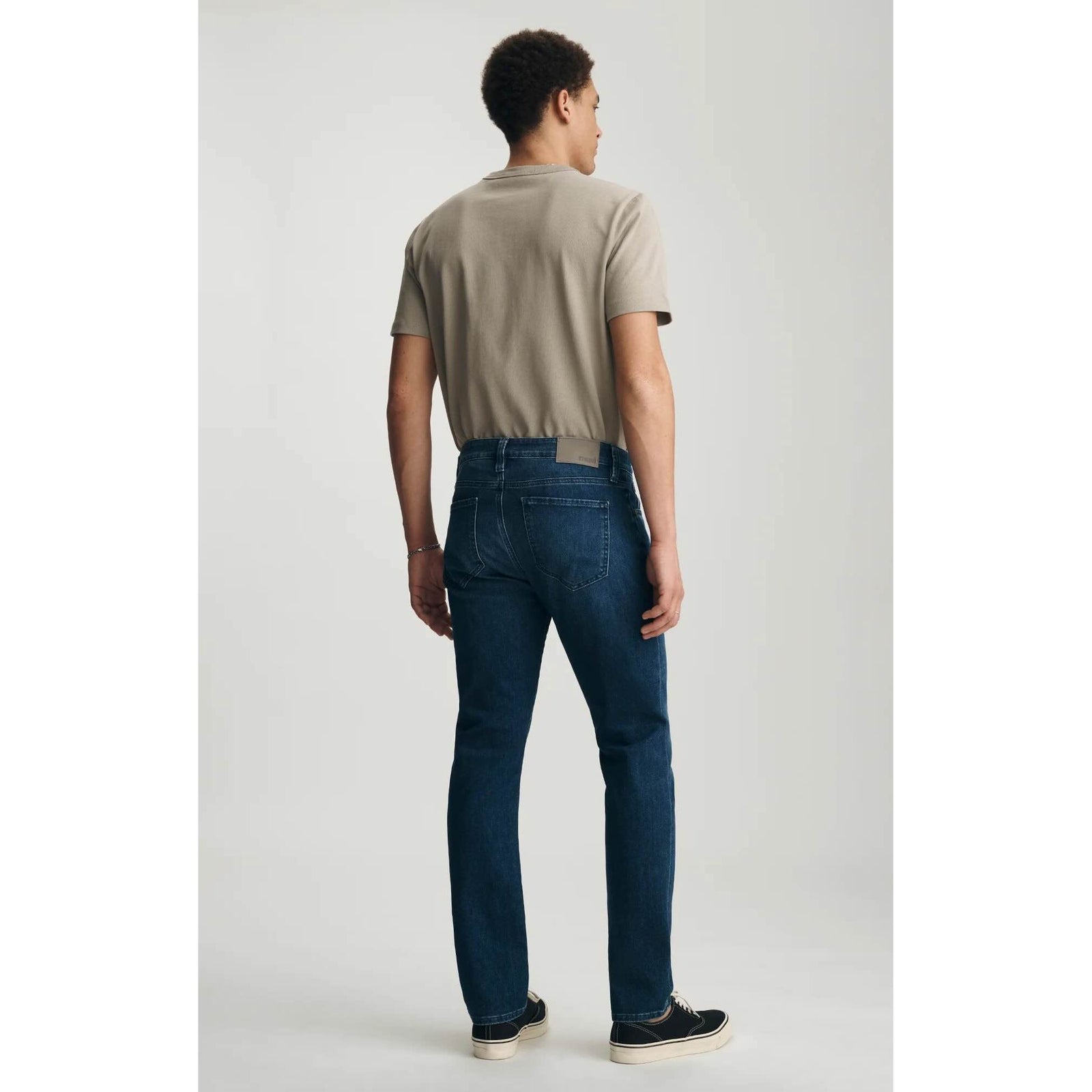 Mavi Marcus Dark Air-Lite Denim on male model, back view, slim-straight silhouette, dark blue jeans.