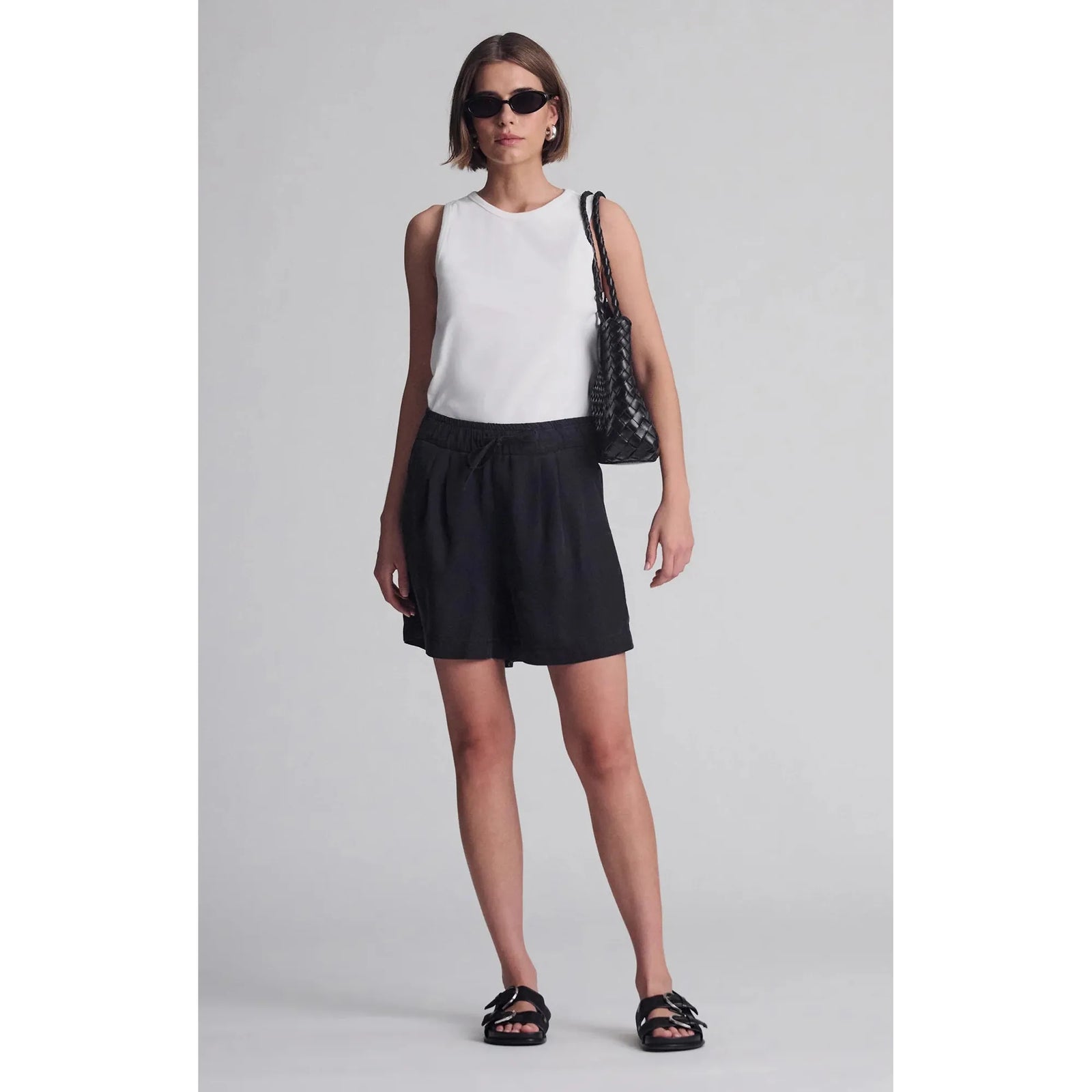 Stylish Mavi Penny shorts in black with a drawstring waist, perfect for summer strolls and hangouts.