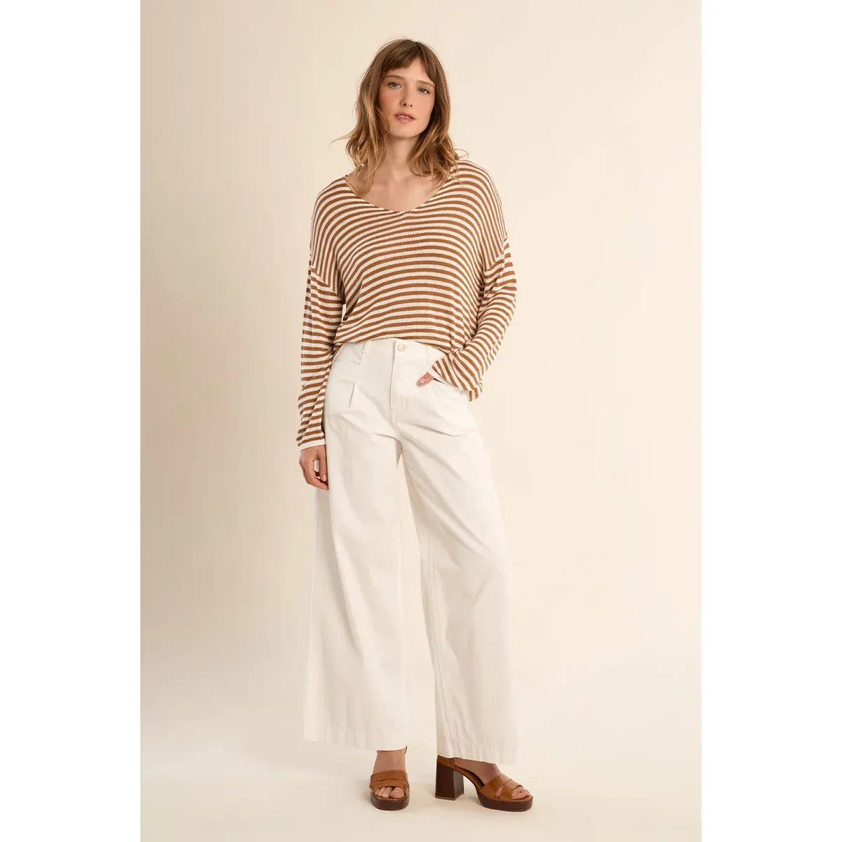 Molly Bracken Long Sleeve Sailor Shirt: striped knit, relaxed oversized fit, V-neck, paired with white wide-leg pants.