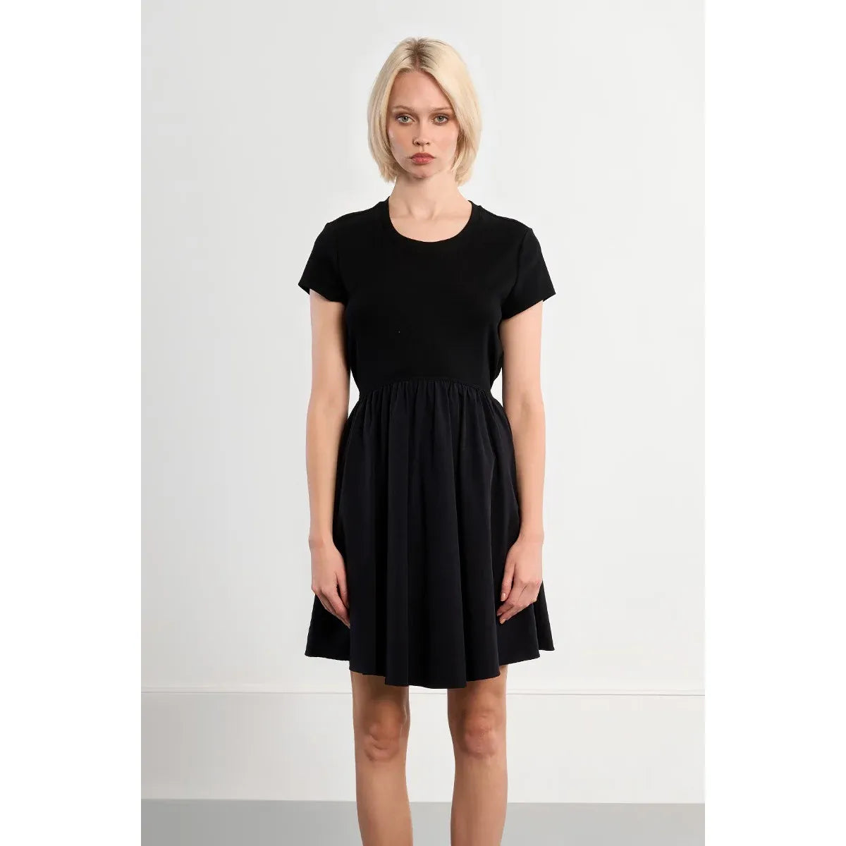 Molly Bracken black nylon mini dress with short sleeves, boat neck, adjustable waist drawstring.