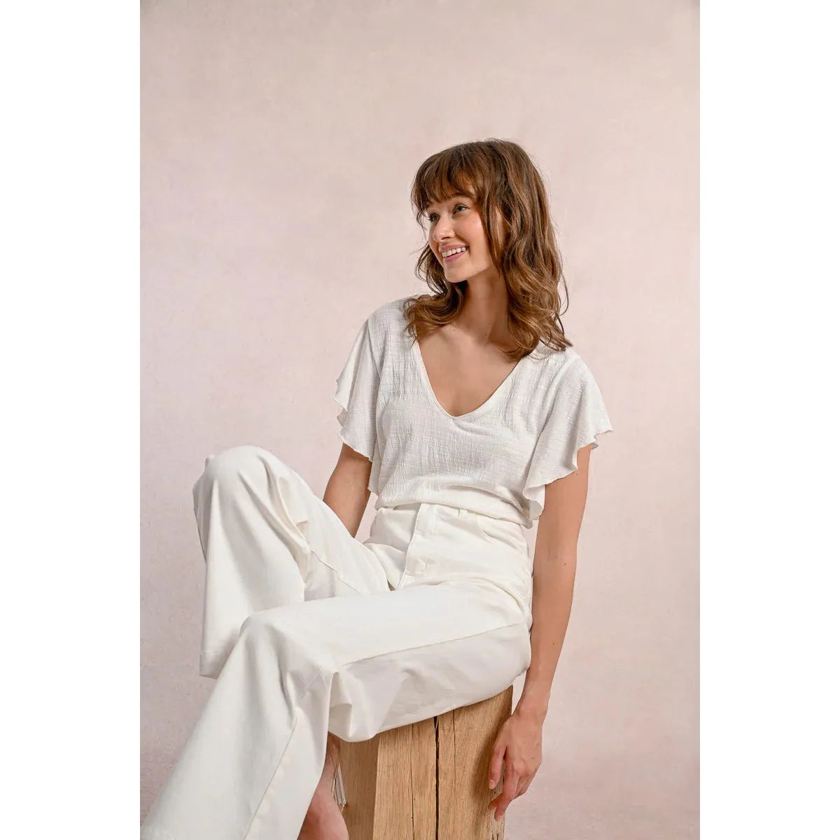 Molly Bracken Ruffled Tshirt styled with ruffled sleeves and a V neckline, perfect for adding flair to your wardrobe.