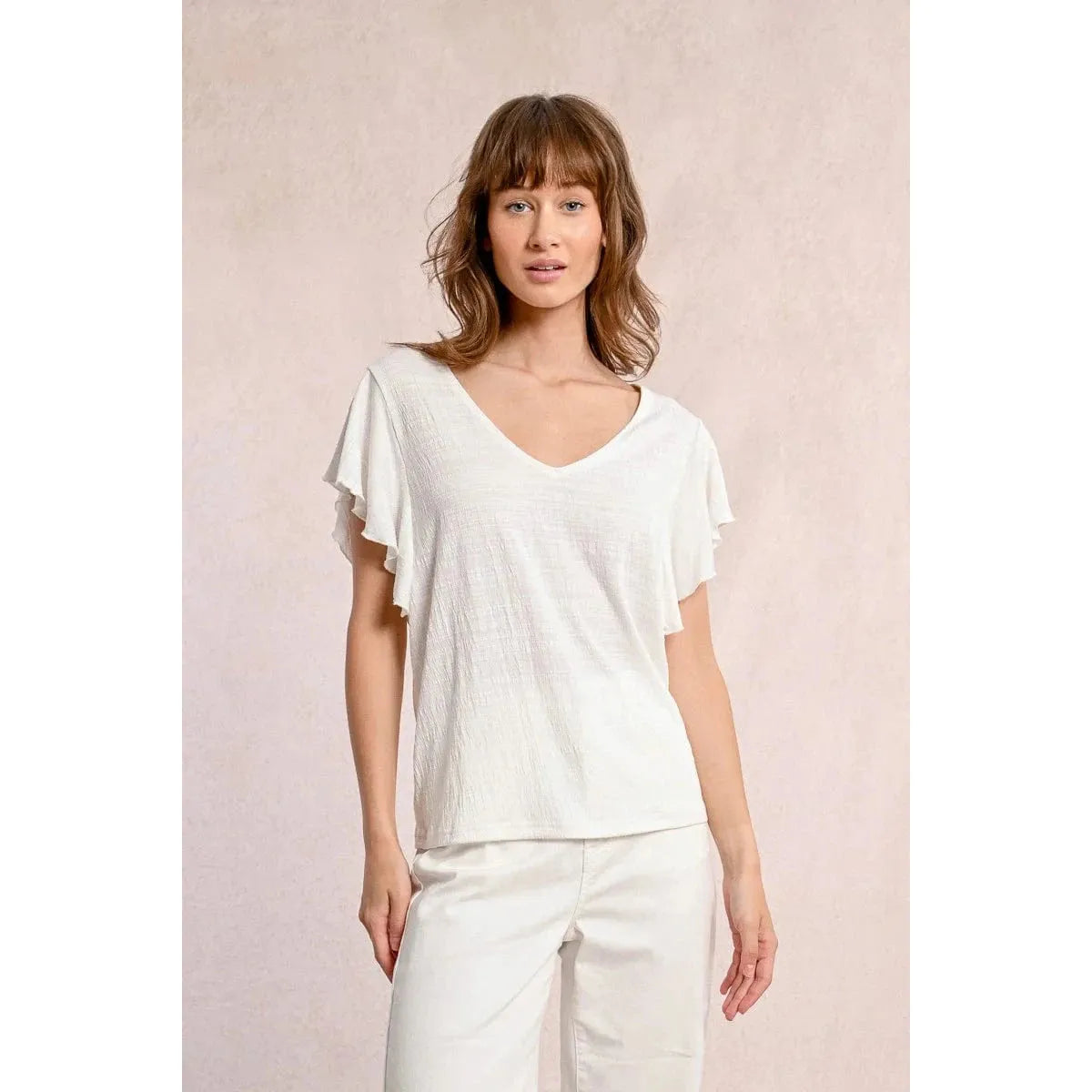Molly Bracken Ruffled Tshirt in off-white, featuring a V neckline and playful ruffled sleeves for a chic look.