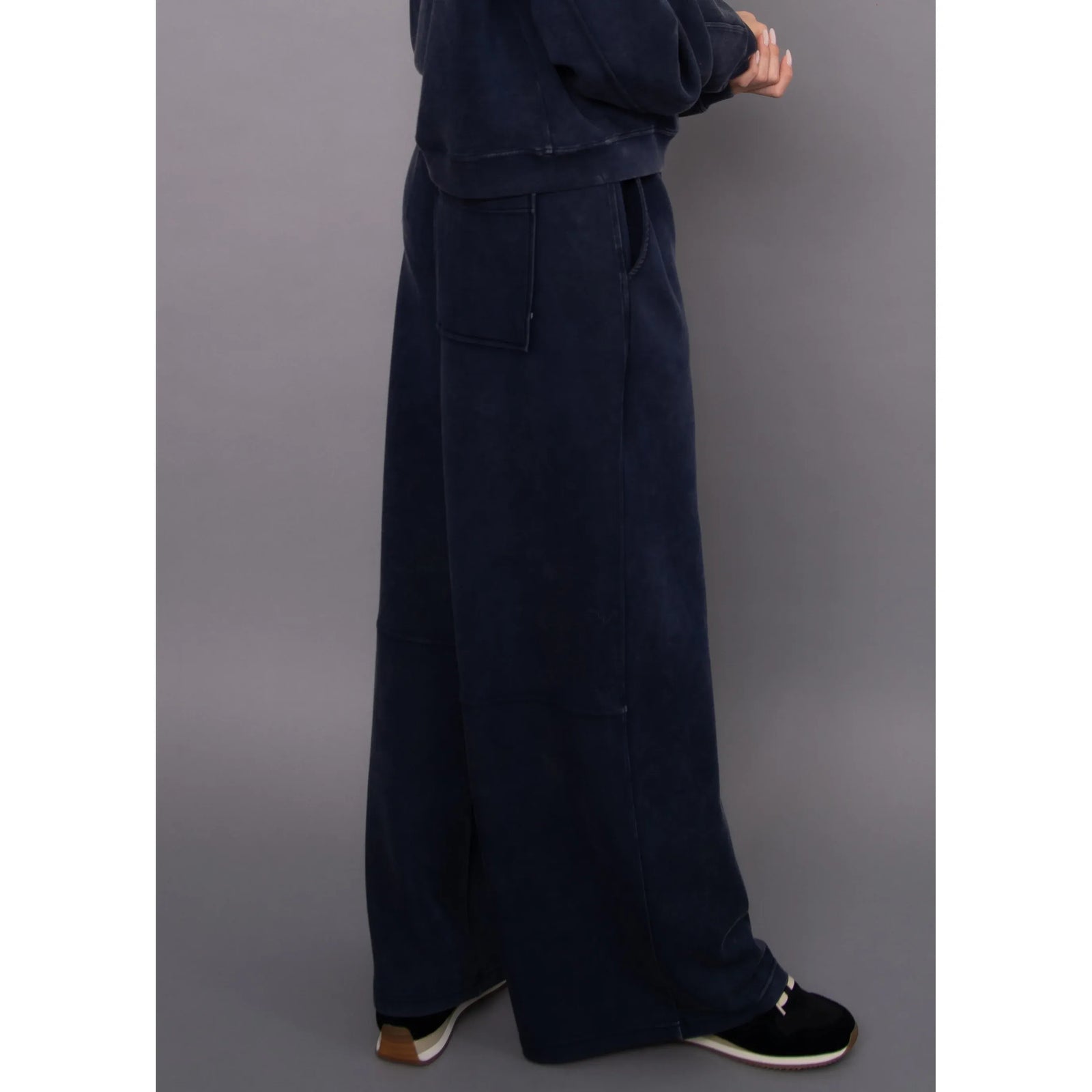 Navy mineral wash soft knit pull-on pants with relaxed wide-leg fit, side pocket, and clean button-free waistband.