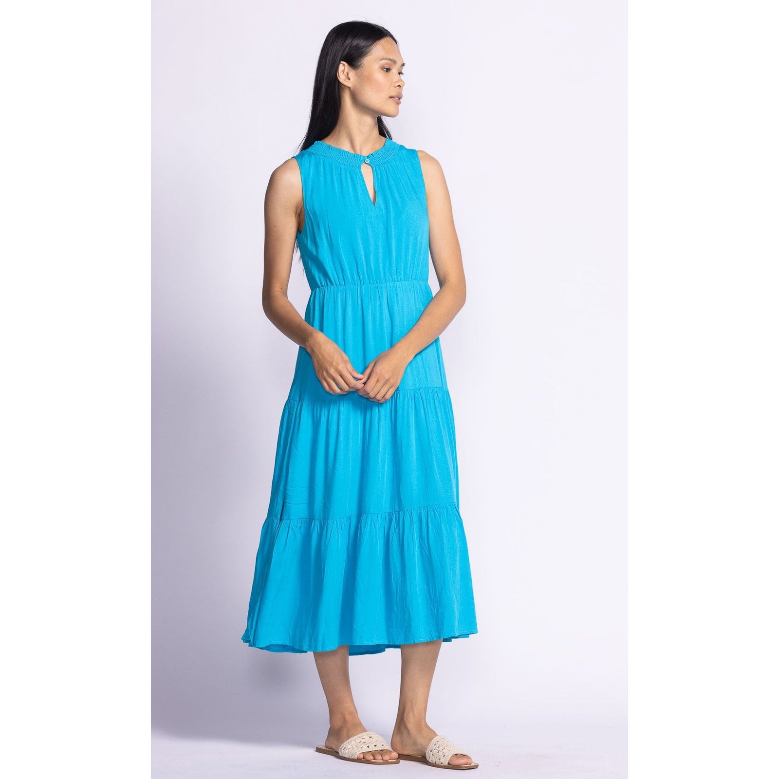 Elevate your style with the Pink Martini Jennifer Dress, featuring a flattering tiered design in vibrant blue.