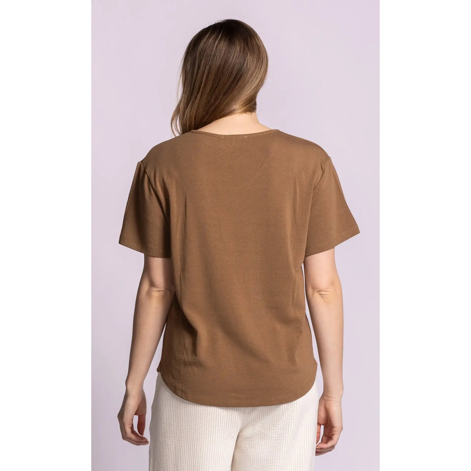 Back view of brown Rhiannon top with relaxed fit, dropped shoulders, and curved hem for comfortable styling.