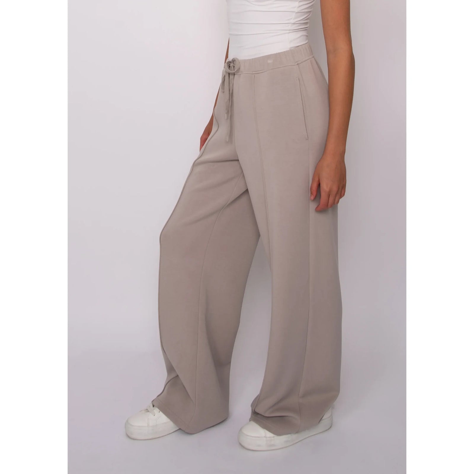 Beige soft knit pull-on drawstring pants with a wide leg fit and adjustable waistband for effortless comfort and style.