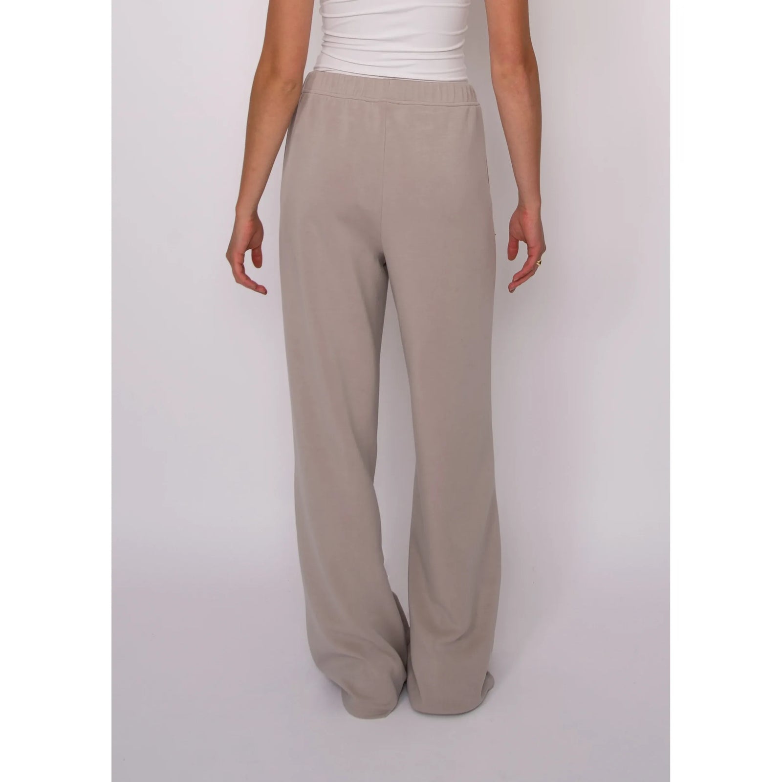 Beige soft knit pull-on drawstring pants featuring a relaxed wide-leg cut and adjustable elastic waistband for effortless comfort.
