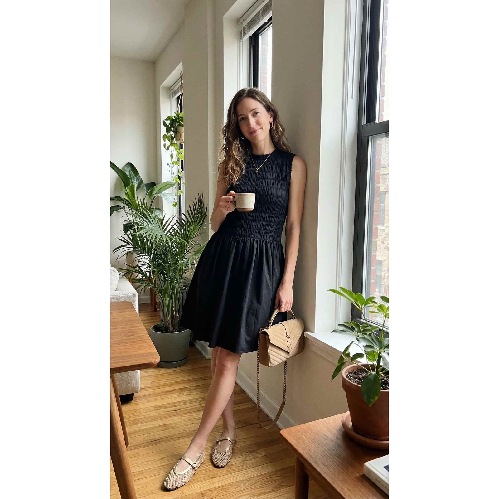 Priv PrimRuched Cocktail Dress: black ruched bodice with a flowy skirt, worn by a woman holding a beige handbag.