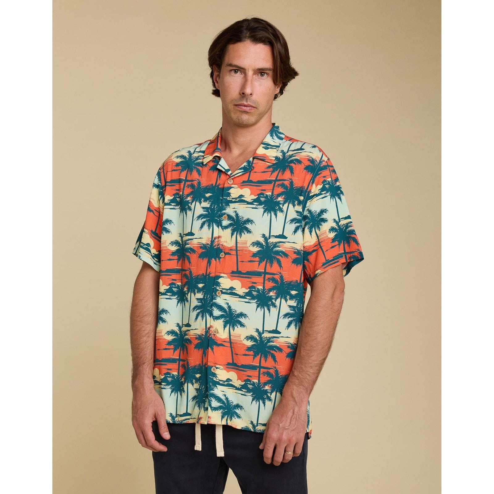 Stylish Pullin BayArbor Beach Shirt features a colorful Hawaiian print, short sleeves, and coconut button details.