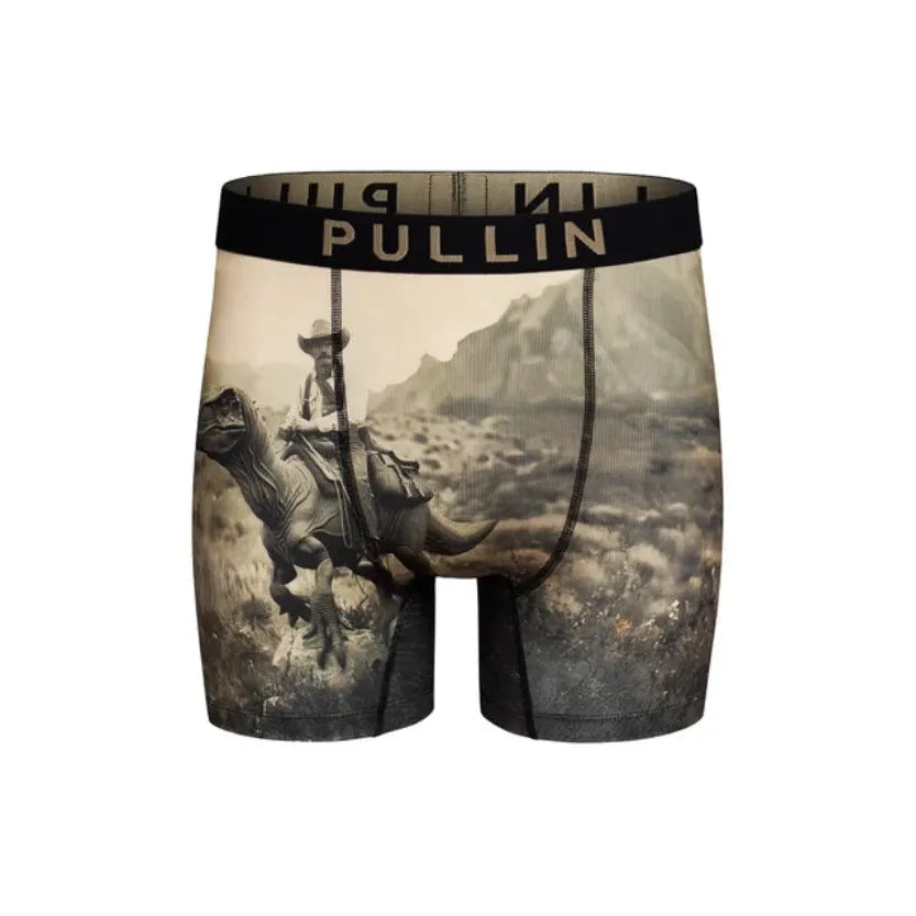 Pullin 2 Raptous boxer shorts featuring a cowboy riding a dinosaur print, wide elastic waistband, and flatlock seams for comfort.