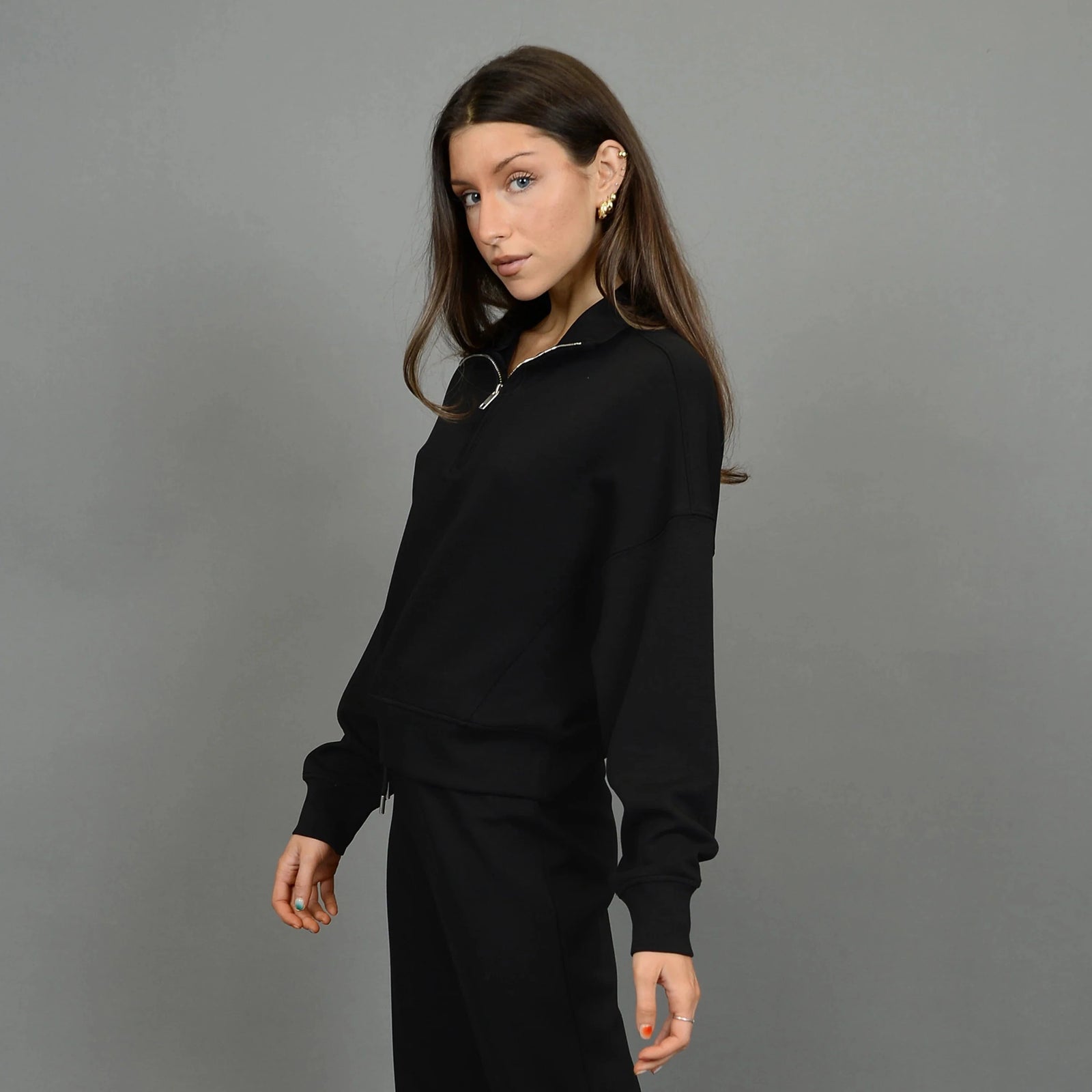 Stylish Mailyn Soft Scuba 1/2 Zip Pull Over in black, perfect for comfort and fashion. Pair with matching pants!