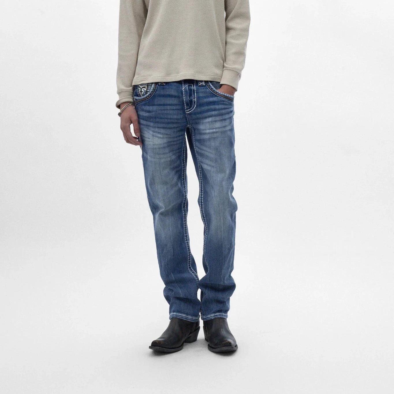 Rock Revival Caleb J200 straight-leg jeans in indigo with subtle fading, contrast stitching, and embroidered back pockets.