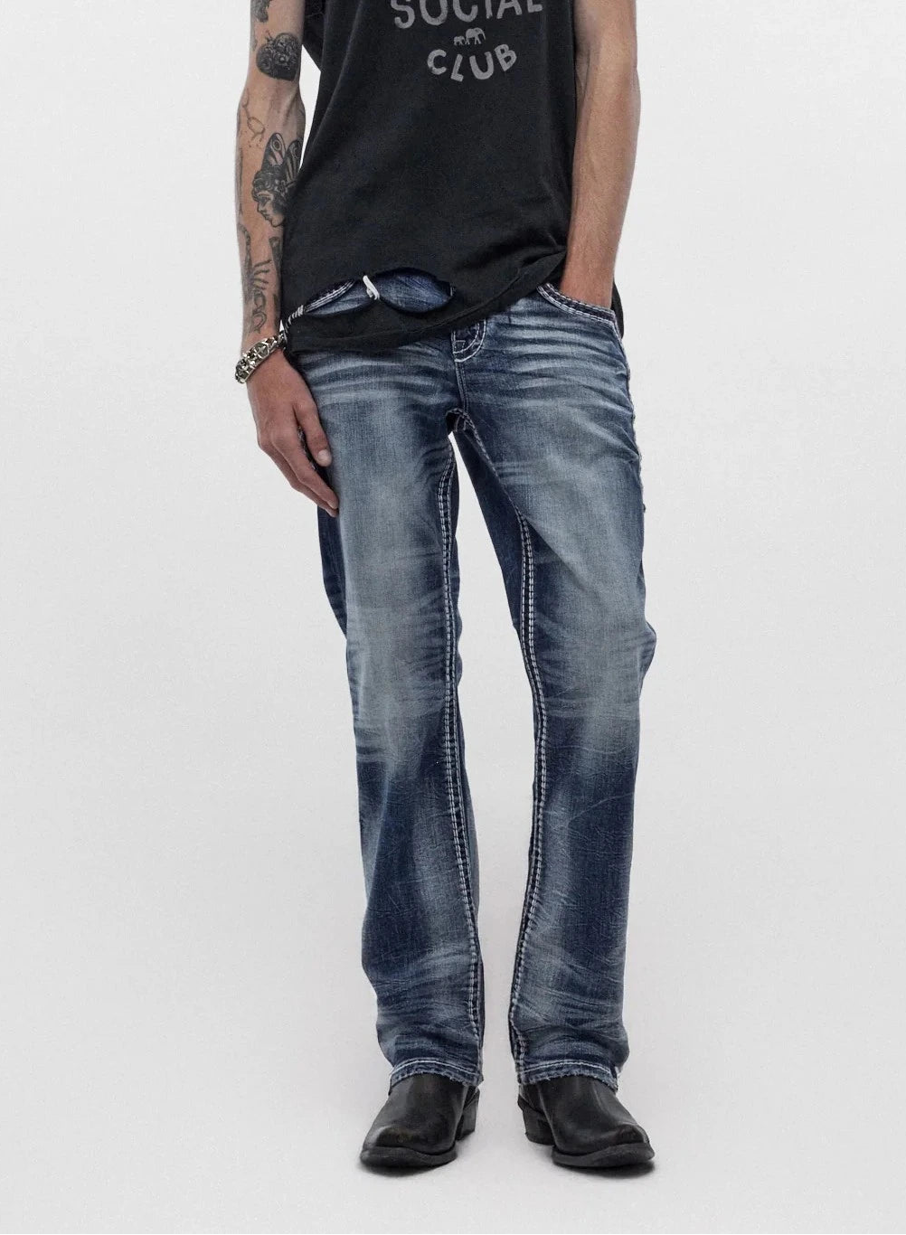 Men's Rock Revival Ozzy B203 bootcut jeans in medium blue wash with whiskering and room through the thigh.