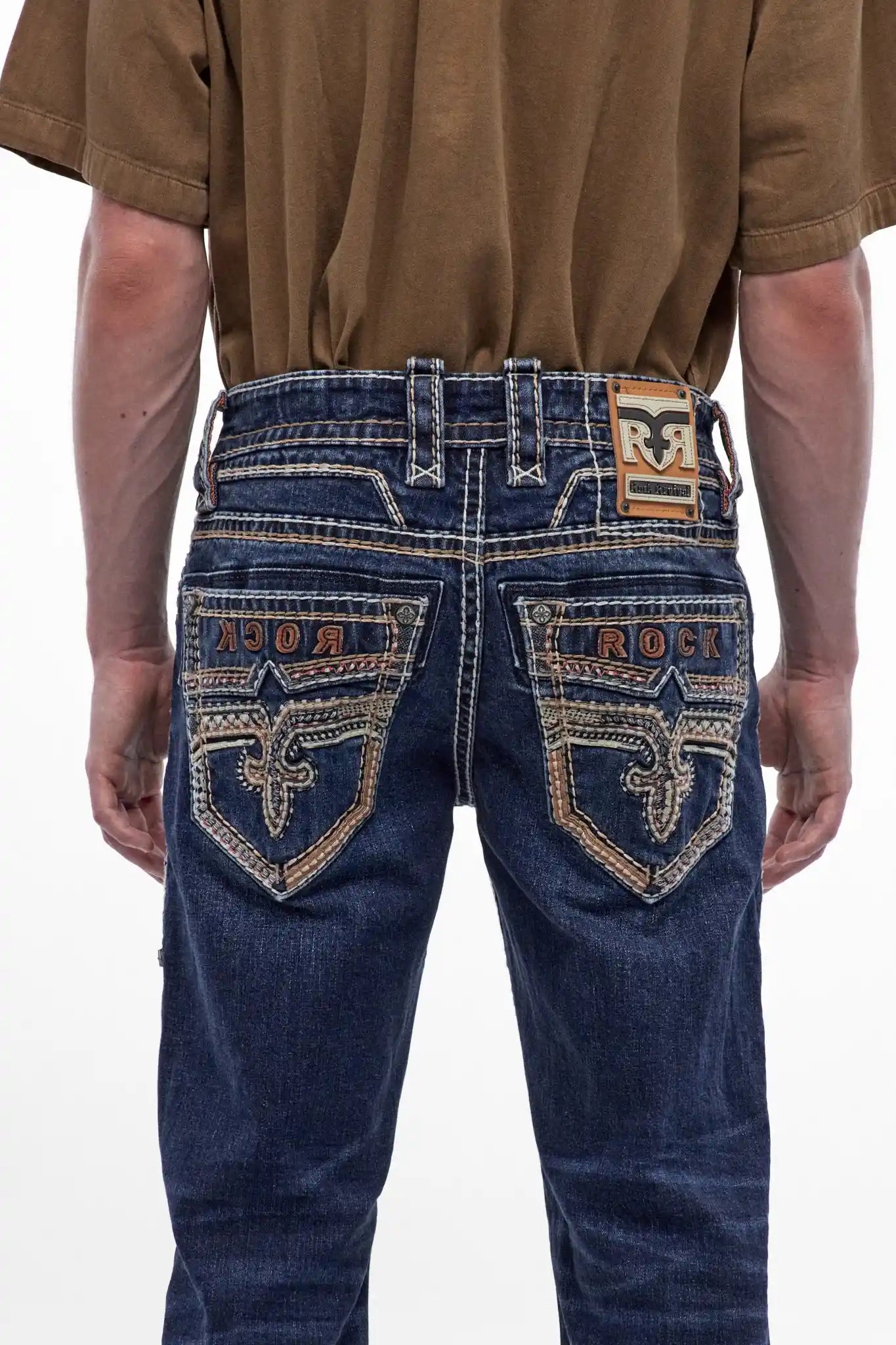 Rock Revival Santiago B208 bootcut jeans in dark blue featuring fleur-de-lis embroidery and "ROCK" stitching on back pockets.
