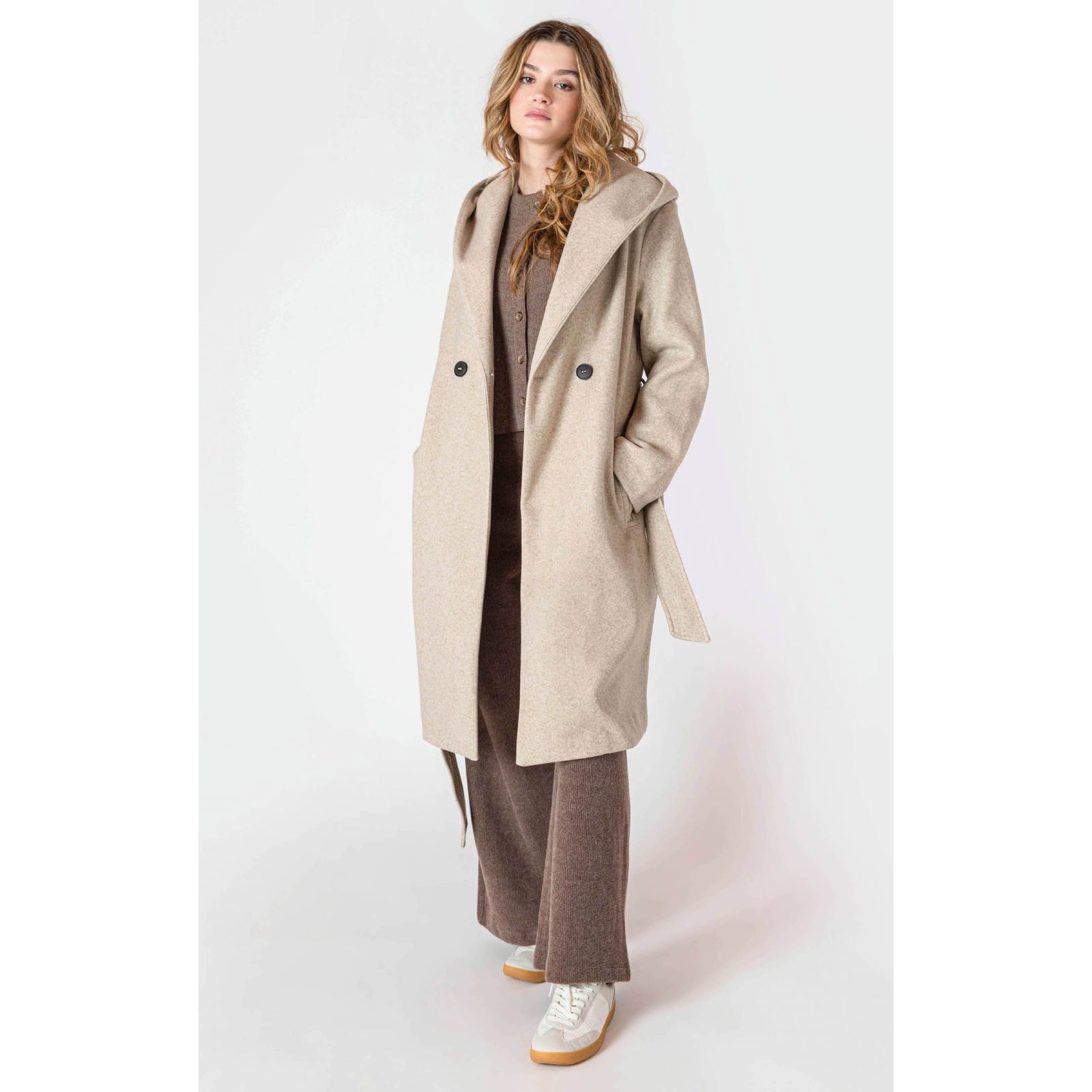 Room 34 Belted Hooded Coat in beige, long belted coat with hood and front buttons worn by a model.