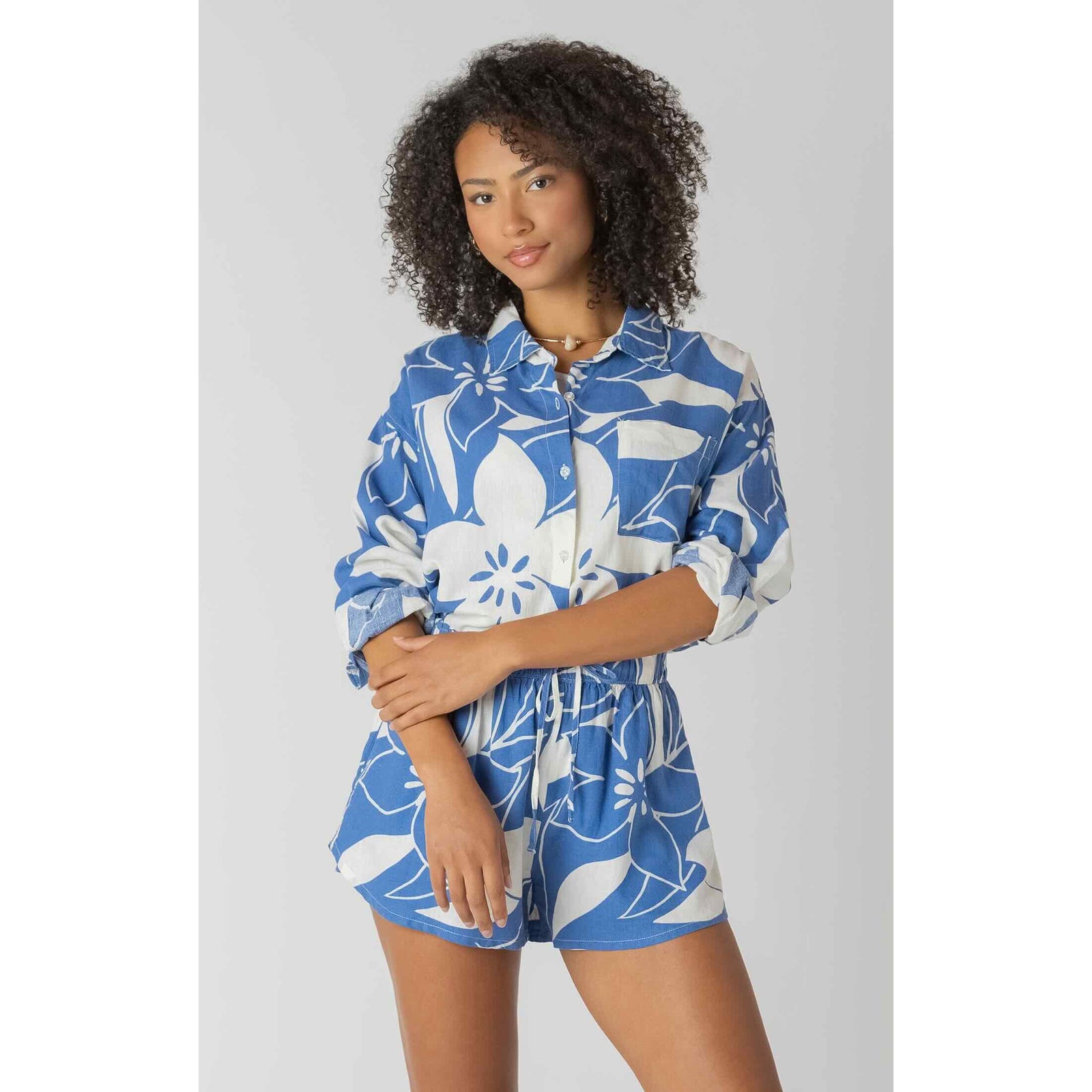 Room 34 Button Front Linen Shirt in blue floral print; lightweight, breathable, classic button-front silhouette.