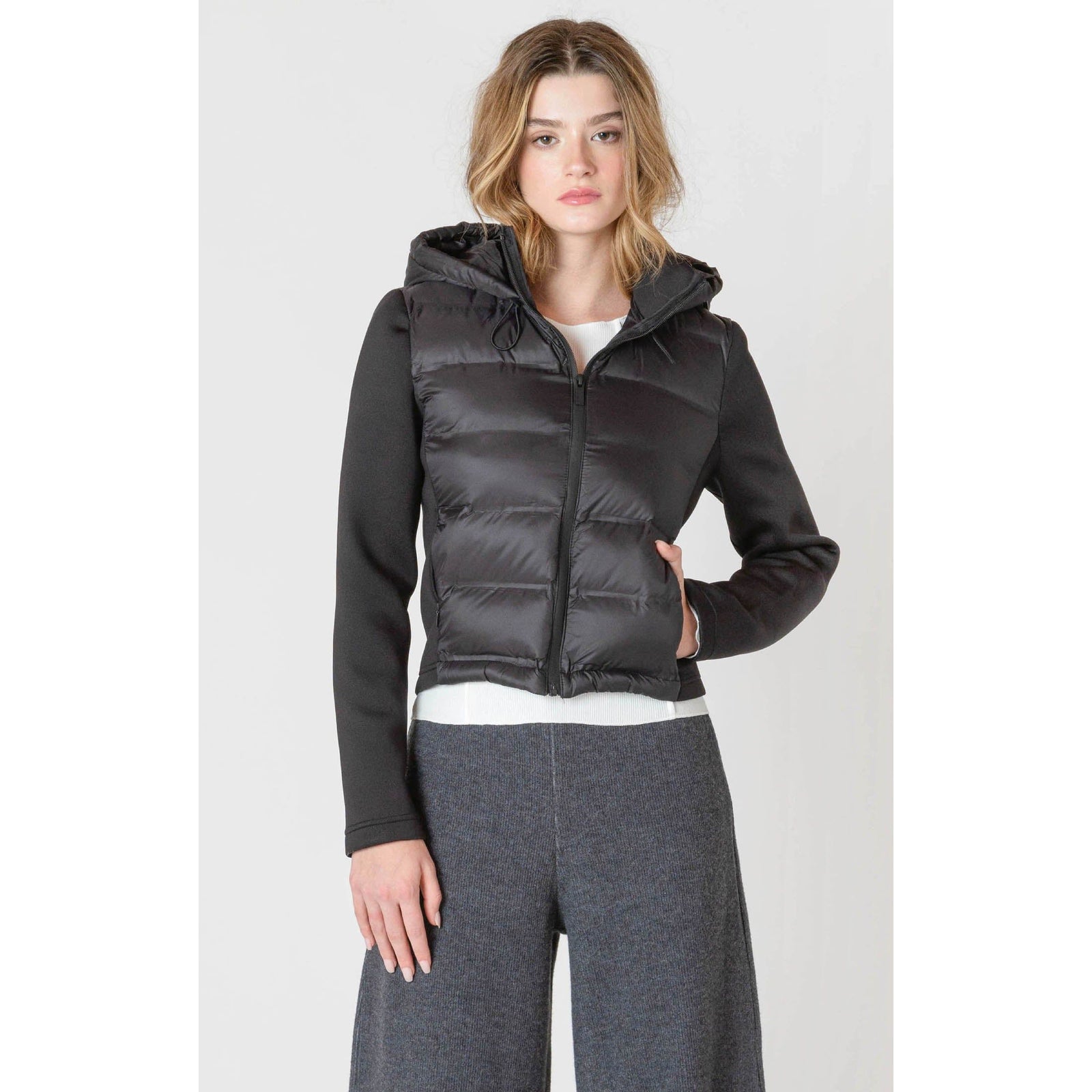 Stylish and cozy, the Room 34 Hooded Puffer Vest features a quilted design perfect for autumn layering.