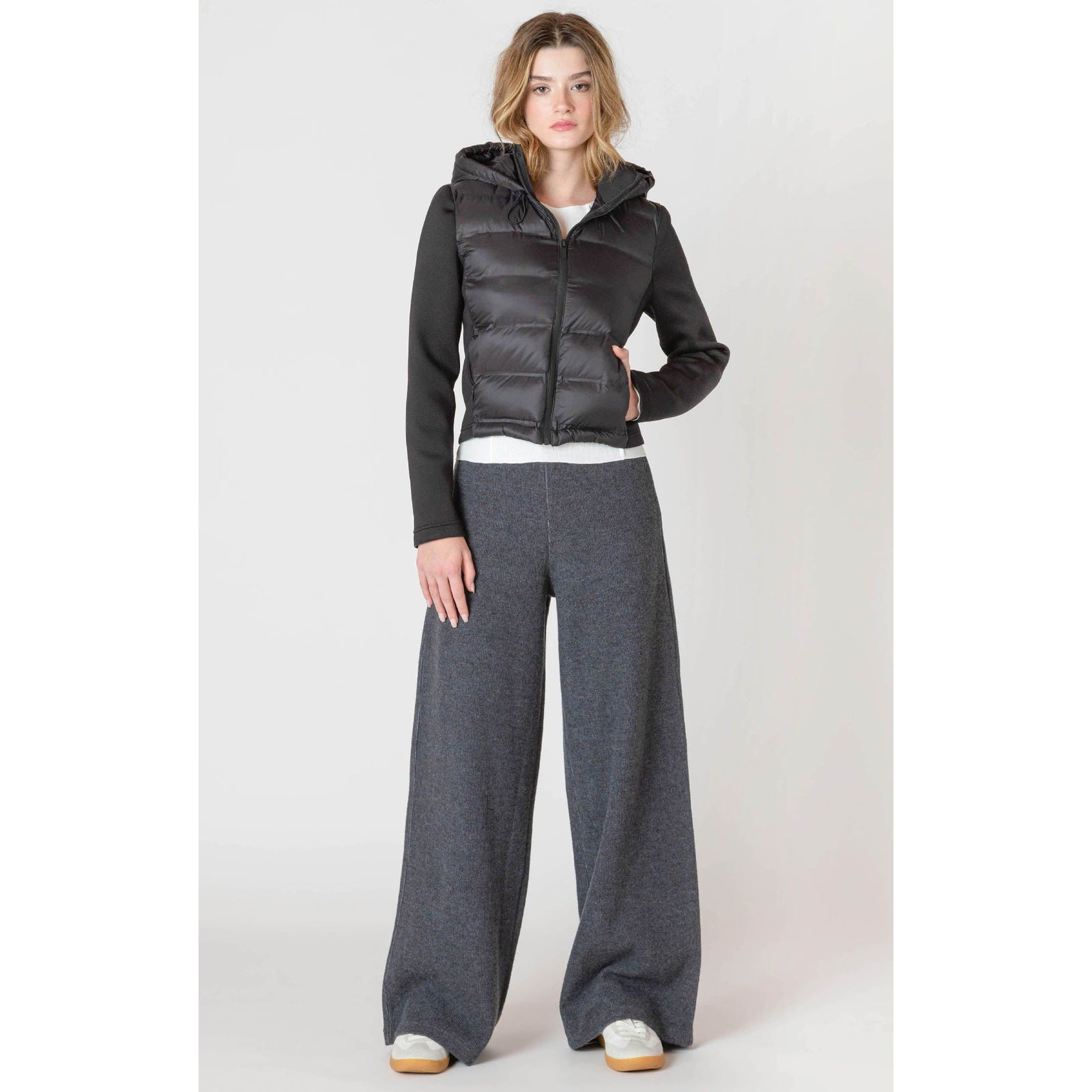 Cozy up in the Room 34 Hooded Puffer Vest, perfect for layering on chilly fall days with its stylish quilted design.