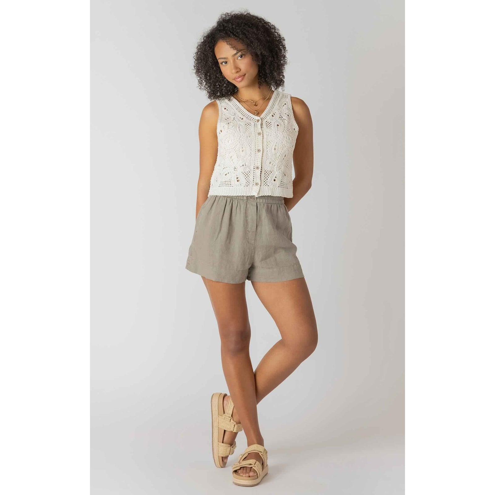 Room 34 Mid-Rise Shorts worn by a model in a cream crochet top; warm-weather casual look.