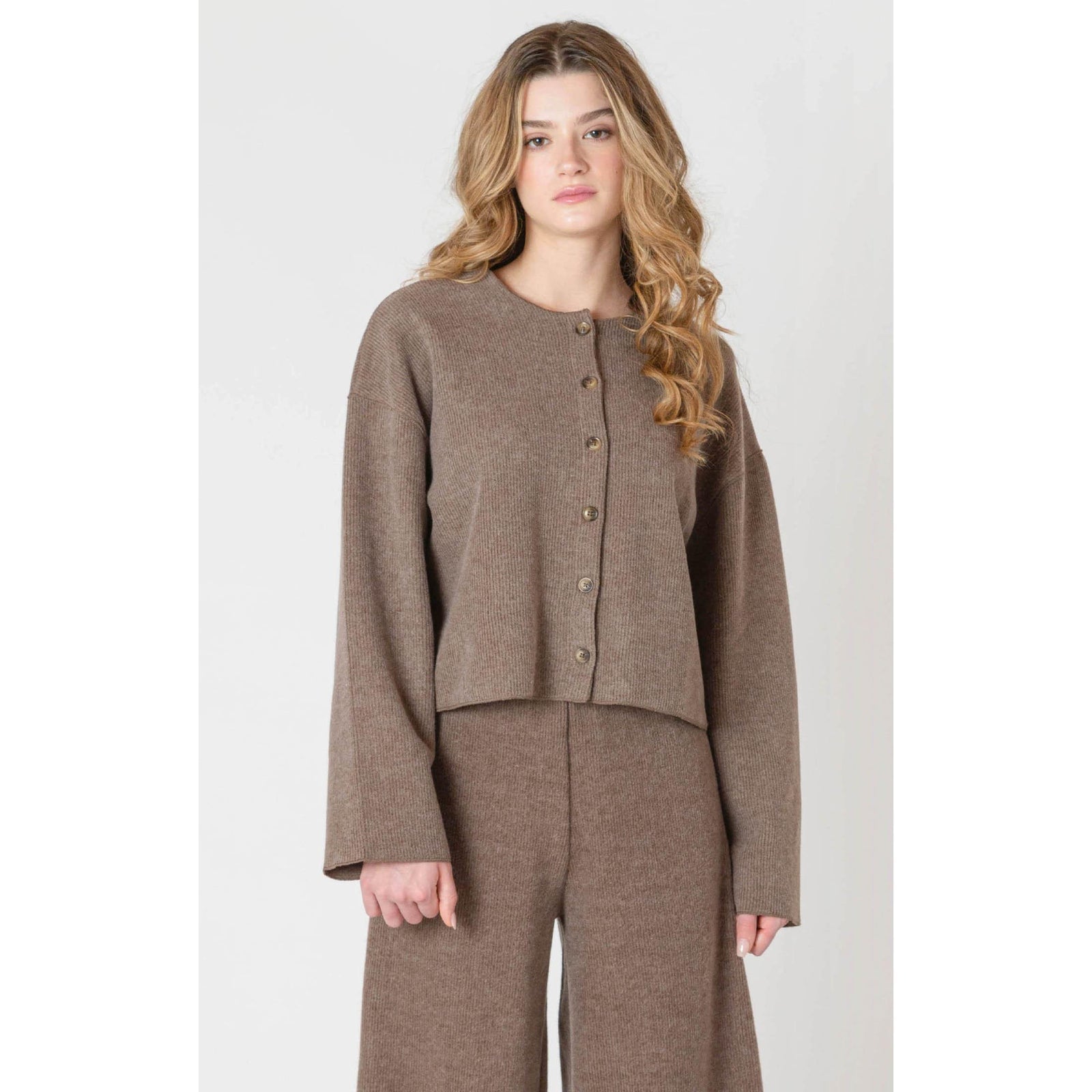 Cozy up in the Room 34 Ribbed Cardigan, featuring long sleeves and a soft ribbed texture for fall days.