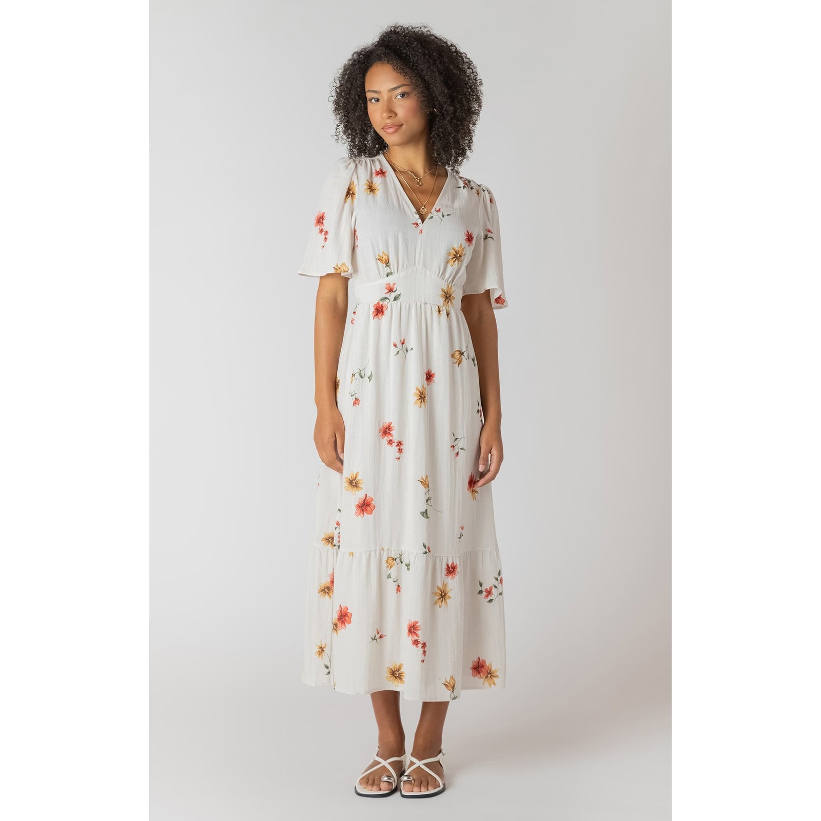Room 34 Short Sleeve Maxi Dress in white floral print, V-neck with smocked waist, on model