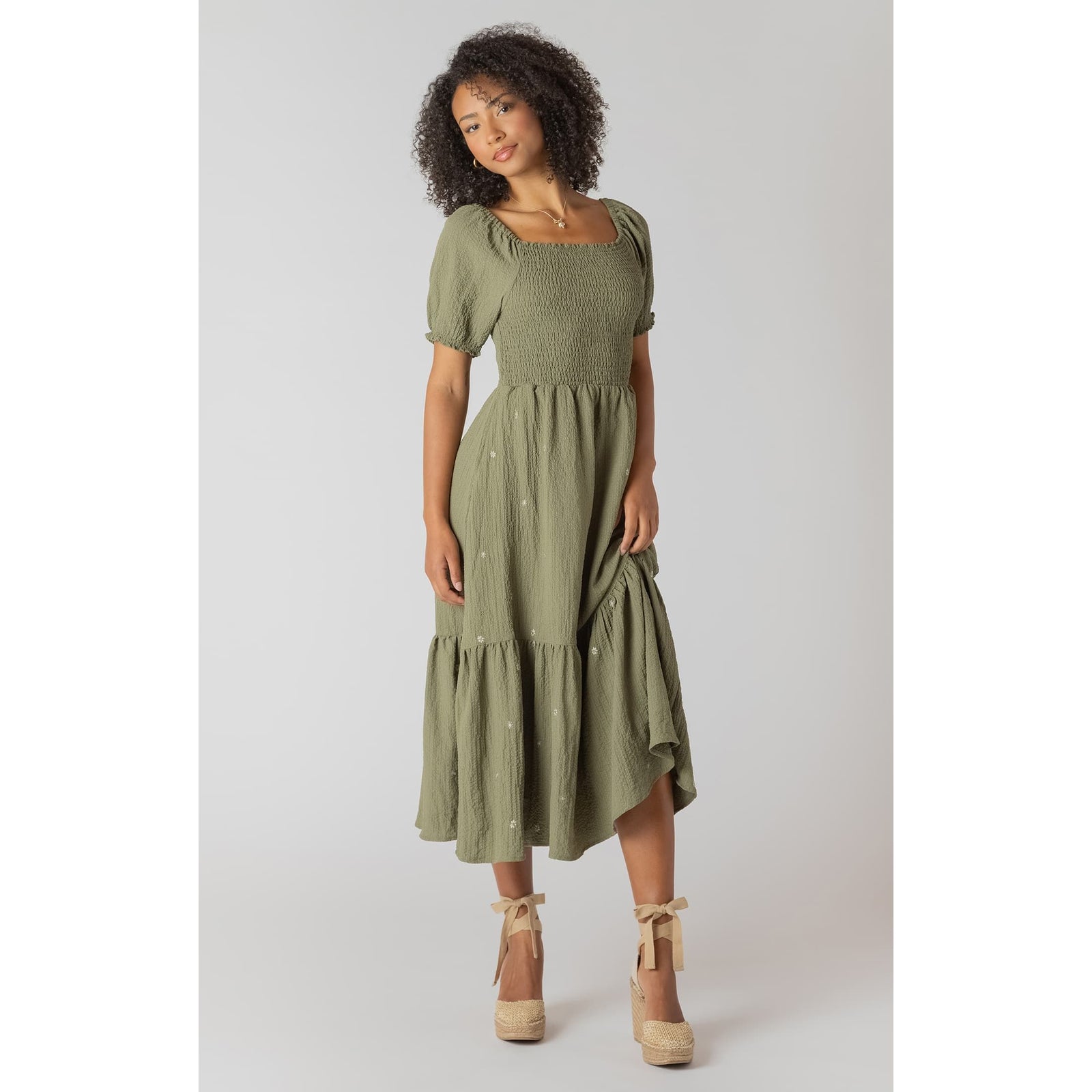 Room 34 Smocked Tiered Maxi Dress in olive green with puff sleeves and embroidered flowers.