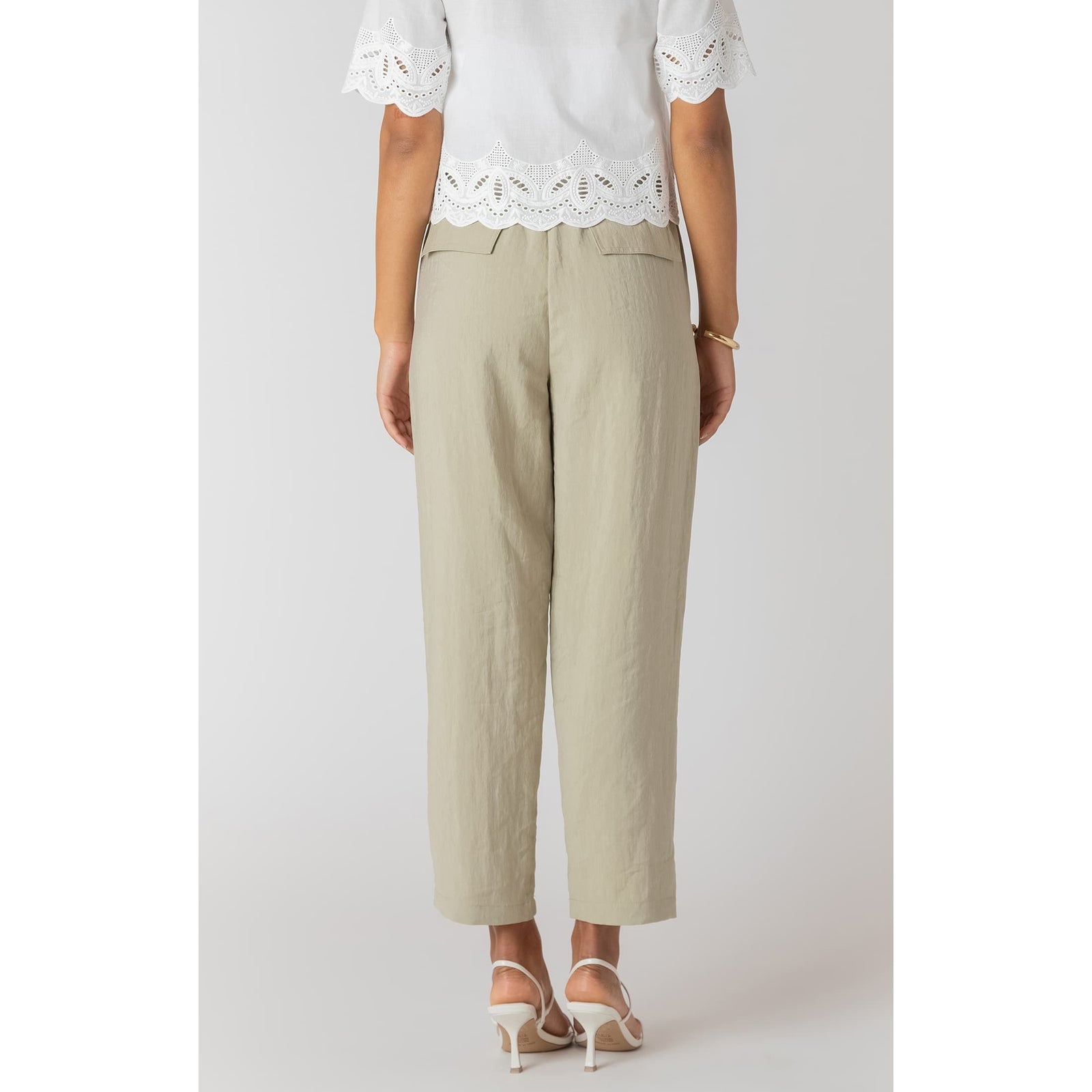 Room 34 straight leg casual pants in light beige with elastic waist and adjustable drawstring, cropped relaxed fit.