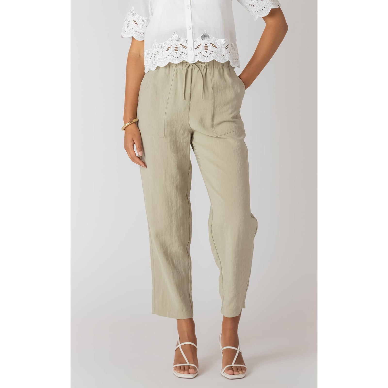 Room 34 lightweight beige straight-leg pants with elastic drawstring waist and cropped relaxed fit.