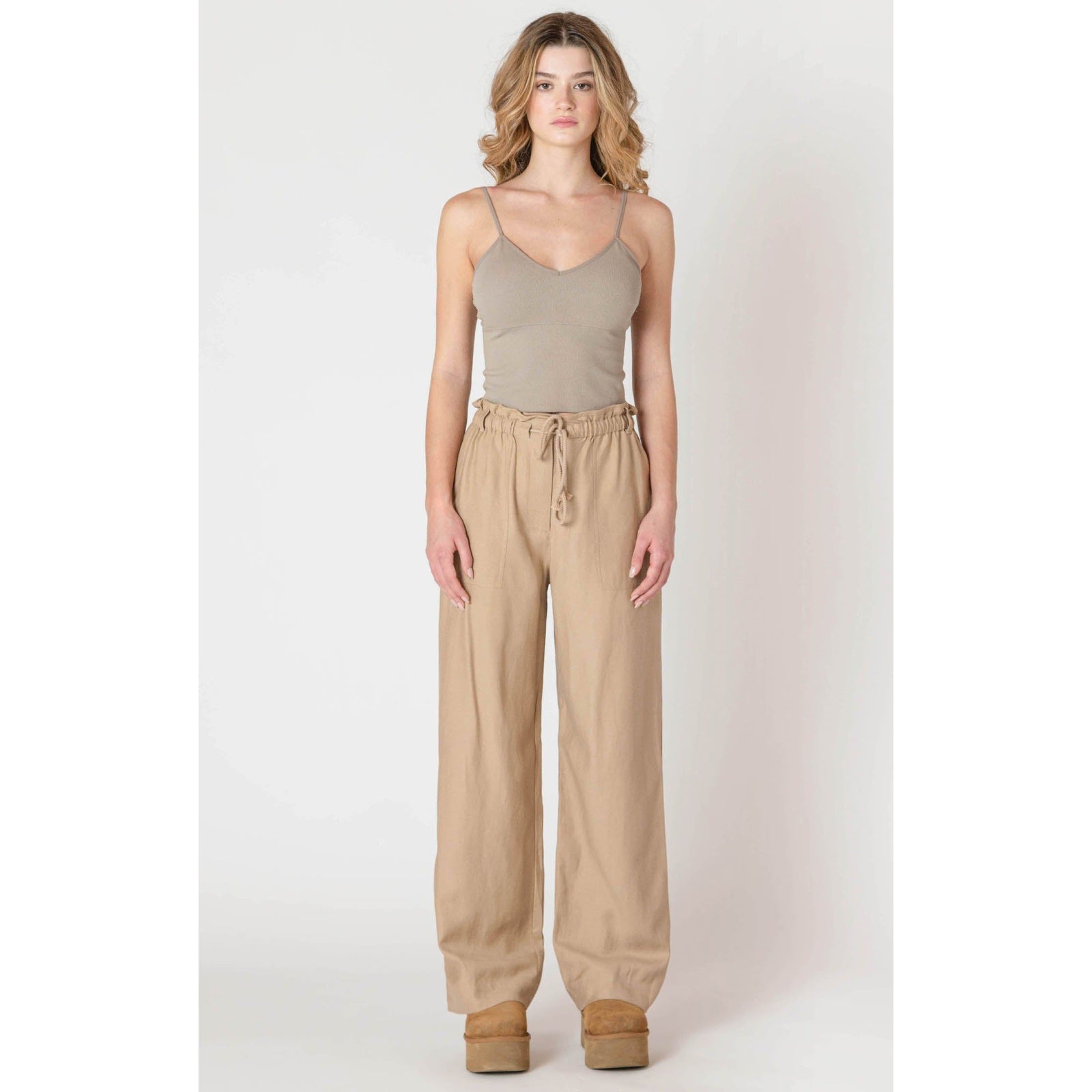 Room 34 Flowy Wide Leg Pants with breezy beige fabric and drawstring waist for chic, relaxed looks.