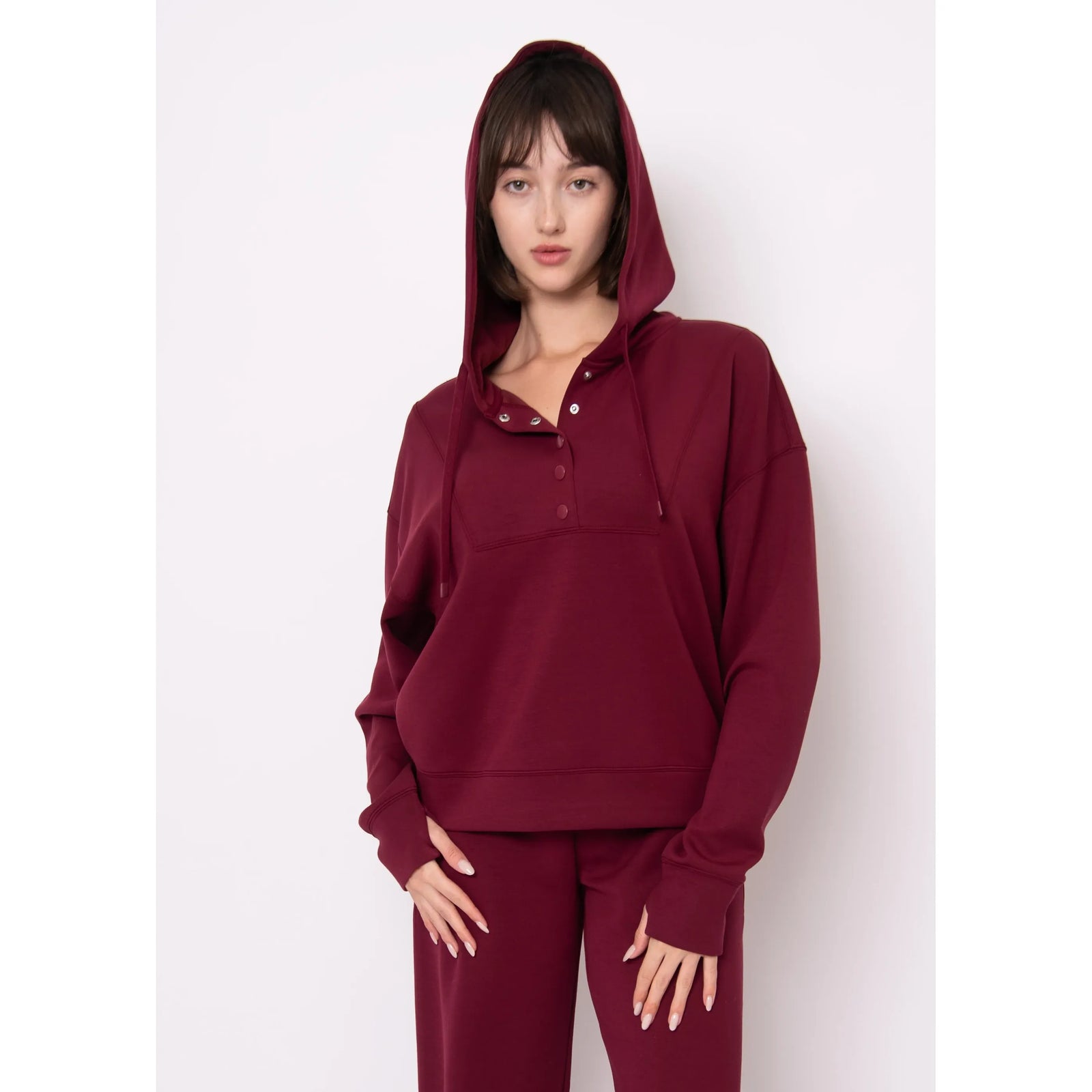 Sallie Soft Knit Snap Front Hoodie on model in burgundy with hood up.