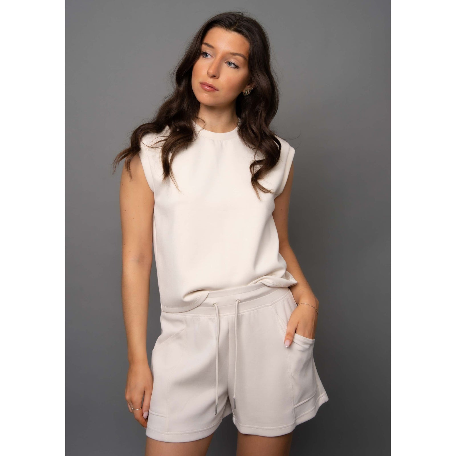 Stylish model wearing the Scuba Miva Soft Knit Tank Top, showcasing comfort and versatility for any outfit.