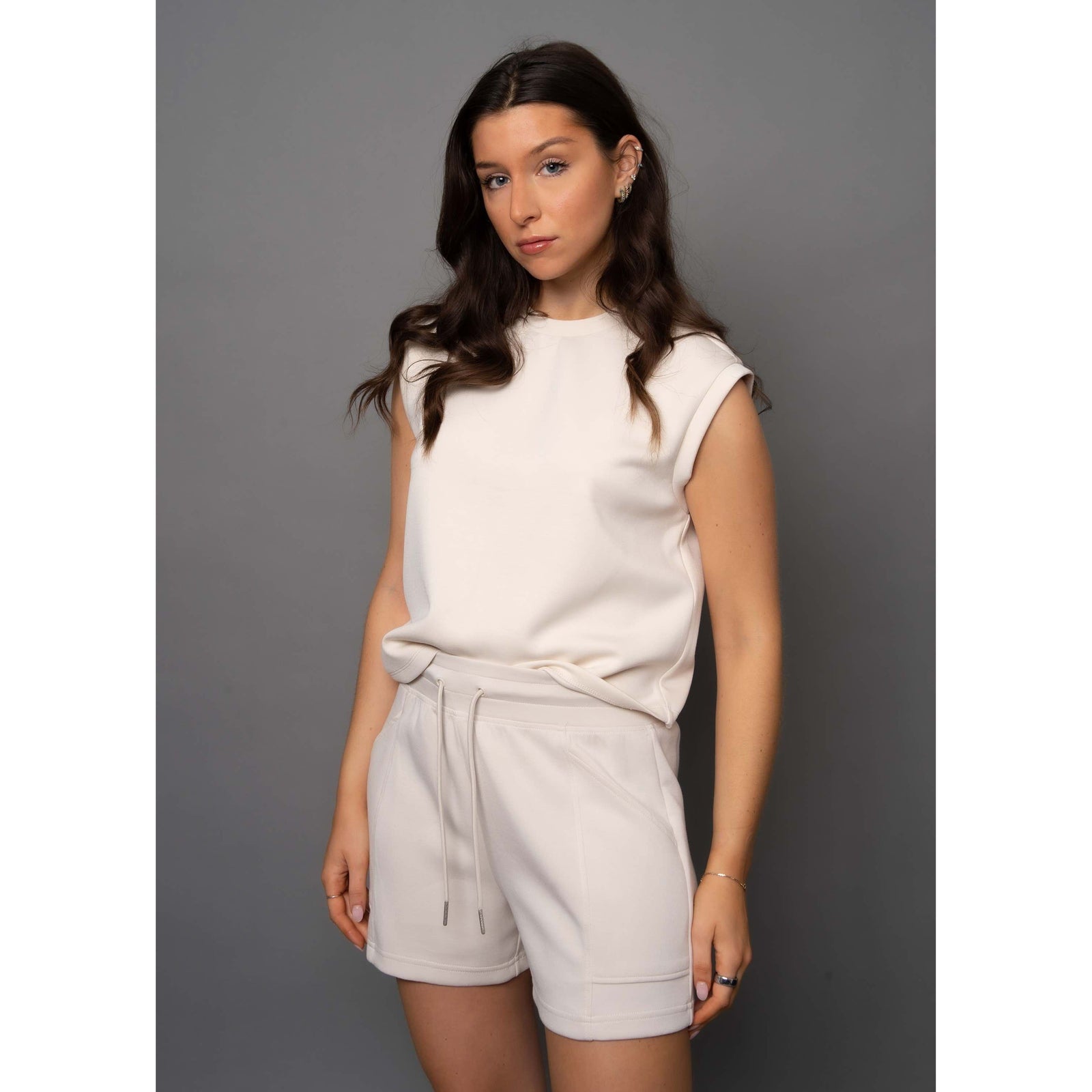 Stylish model wearing the Scuba Miva Soft Knit Tank Top, showcasing its comfort and perfect fit for any outfit.