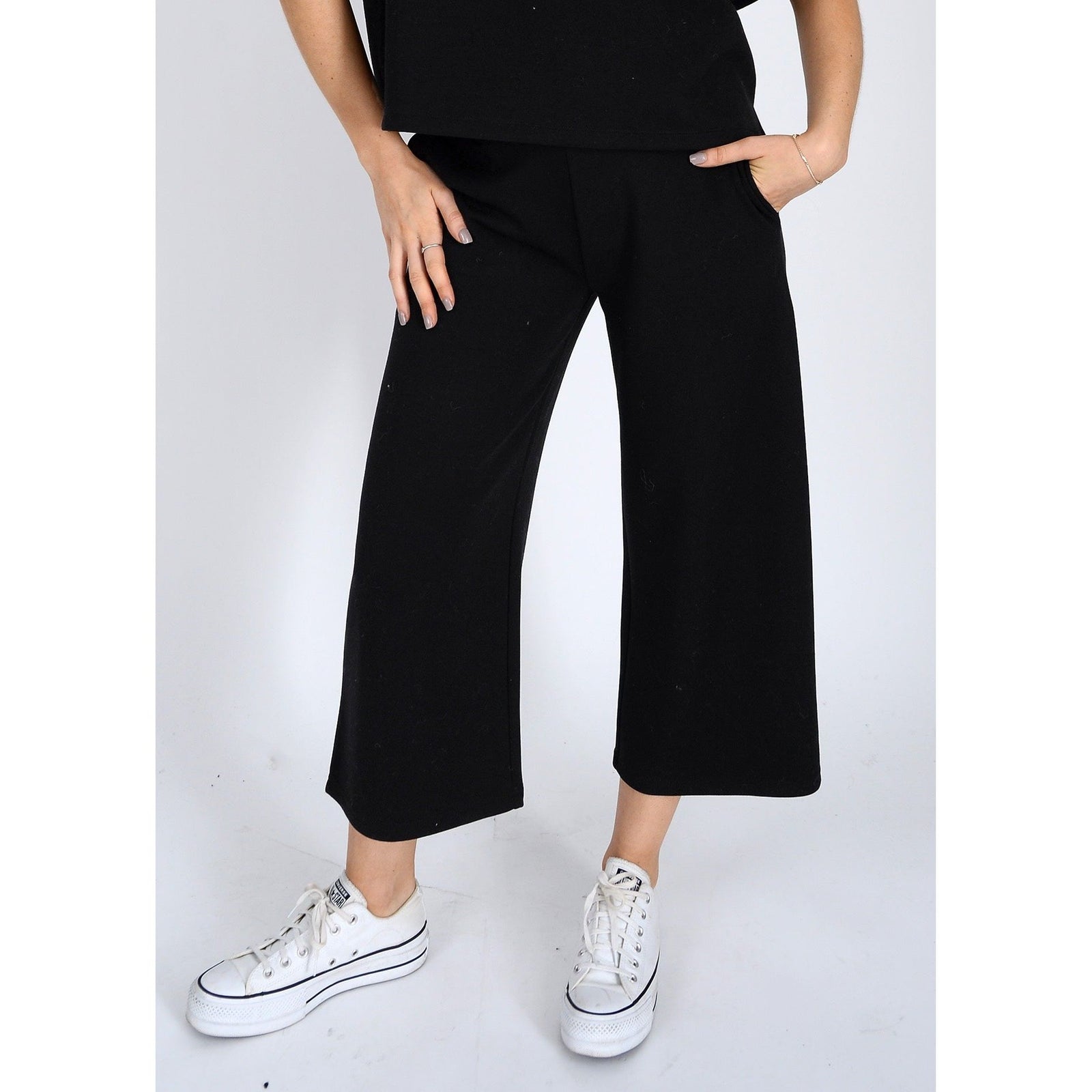 Stylish Scuba Victoria Soft Knit Cropped Pants feature a wide leg and pockets, perfect for comfort and versatility.