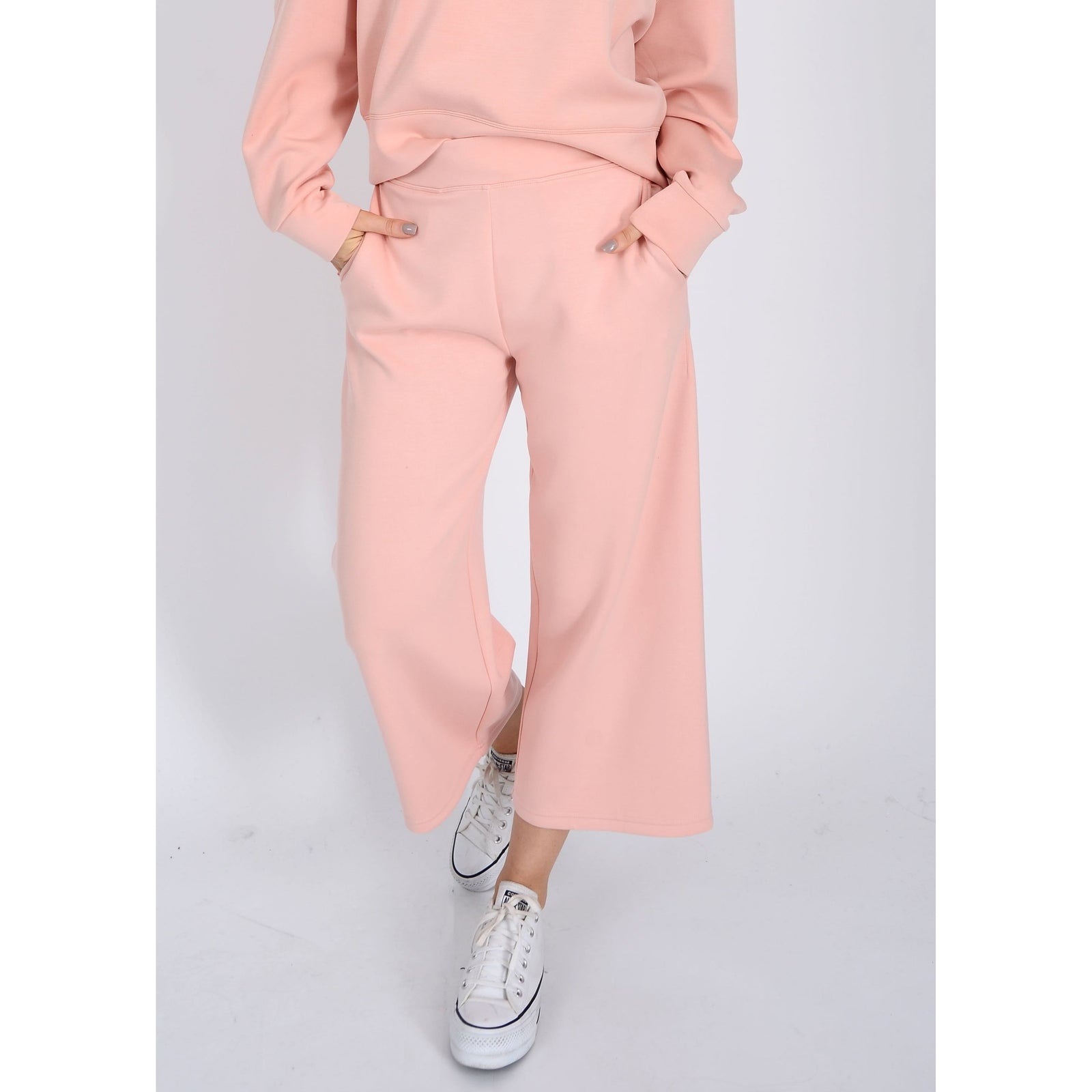 Soft and comfy Scuba Victoria Soft Knit Cropped Pants in dusty peach, perfect for all-day wear and stylish layering.