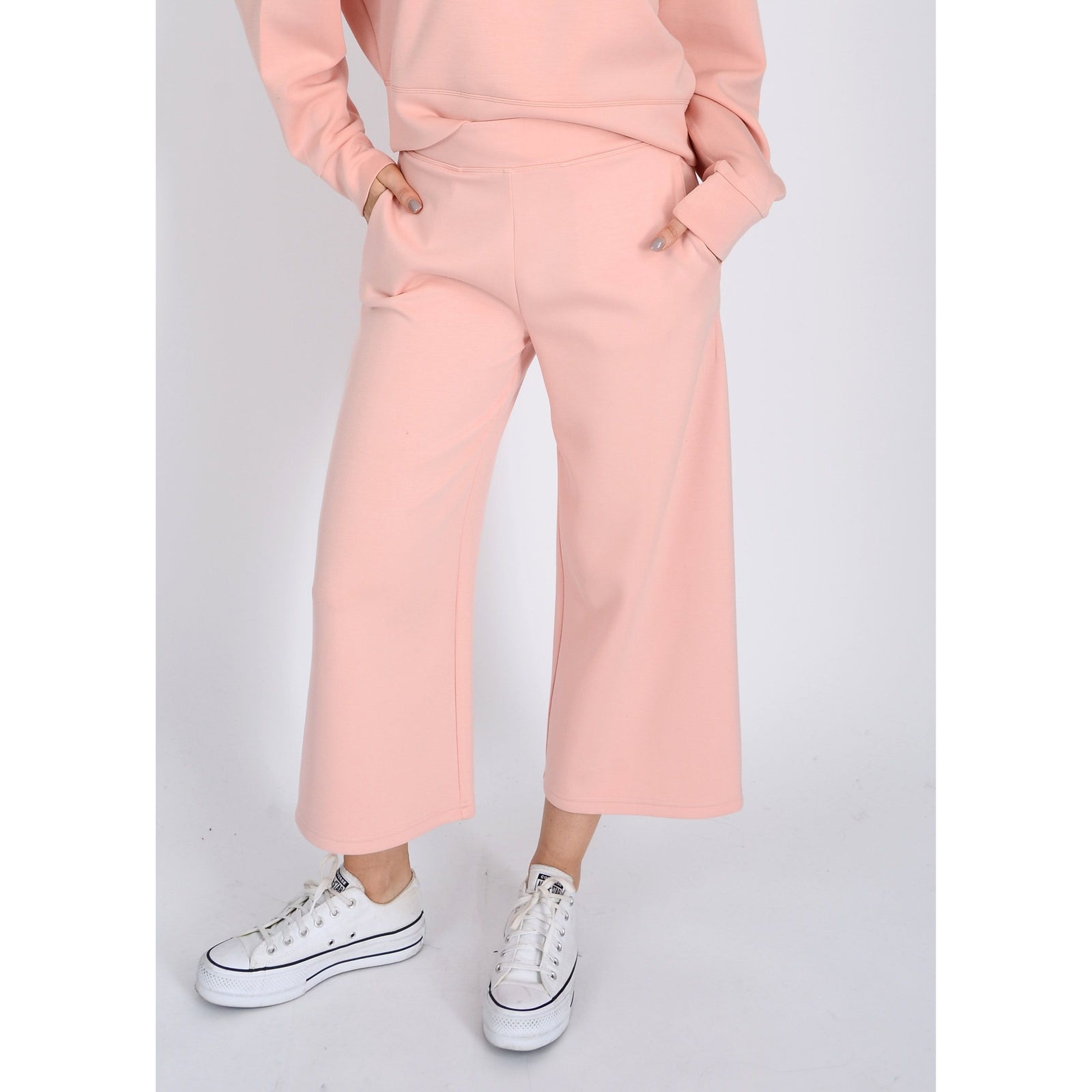 Scuba Victoria Soft Knit Cropped Pants in dusty peach, featuring a wide leg and pockets for ultimate comfort.