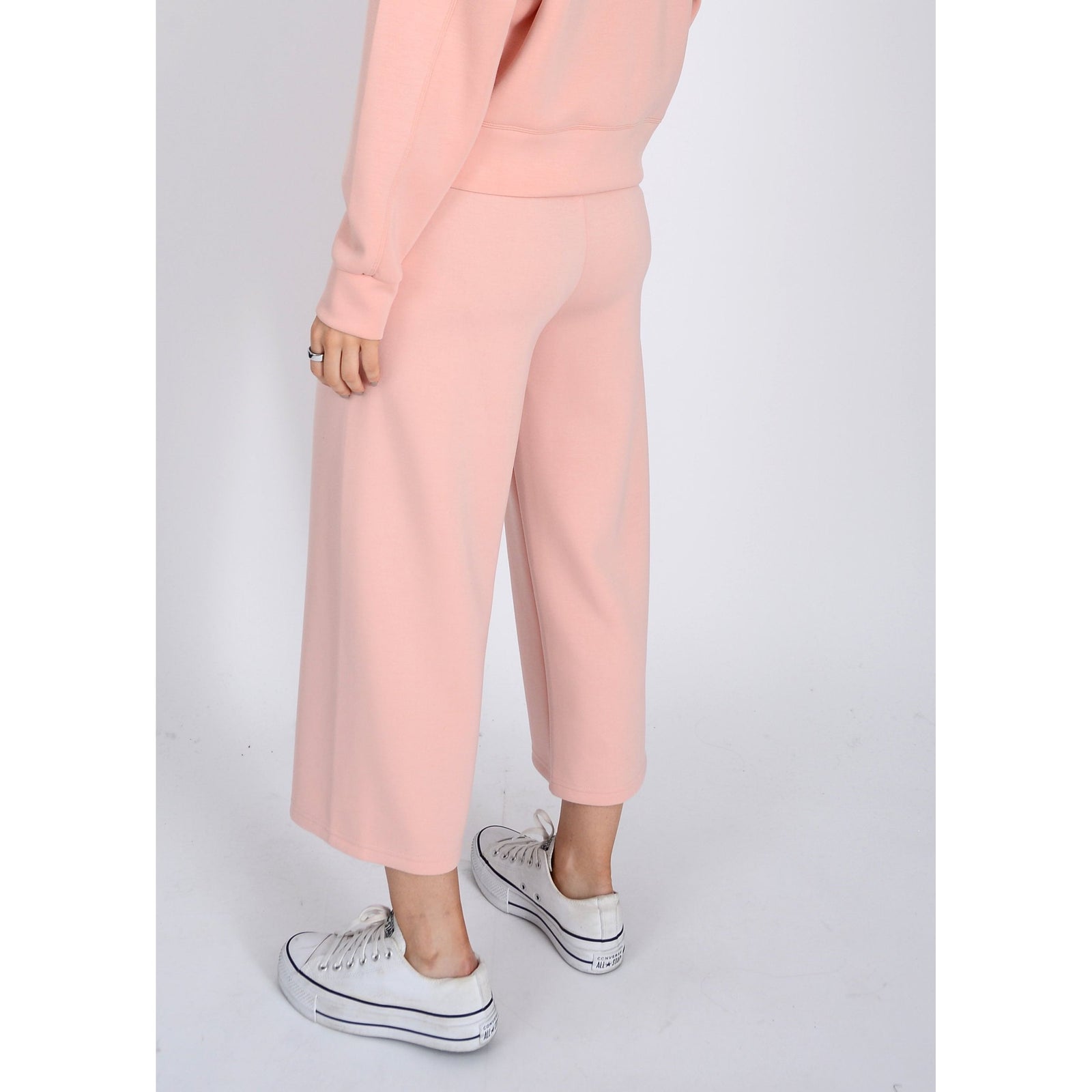 Relax in style with Scuba Victoria Soft Knit Cropped Pants, featuring a wide leg and pockets for ultimate comfort.