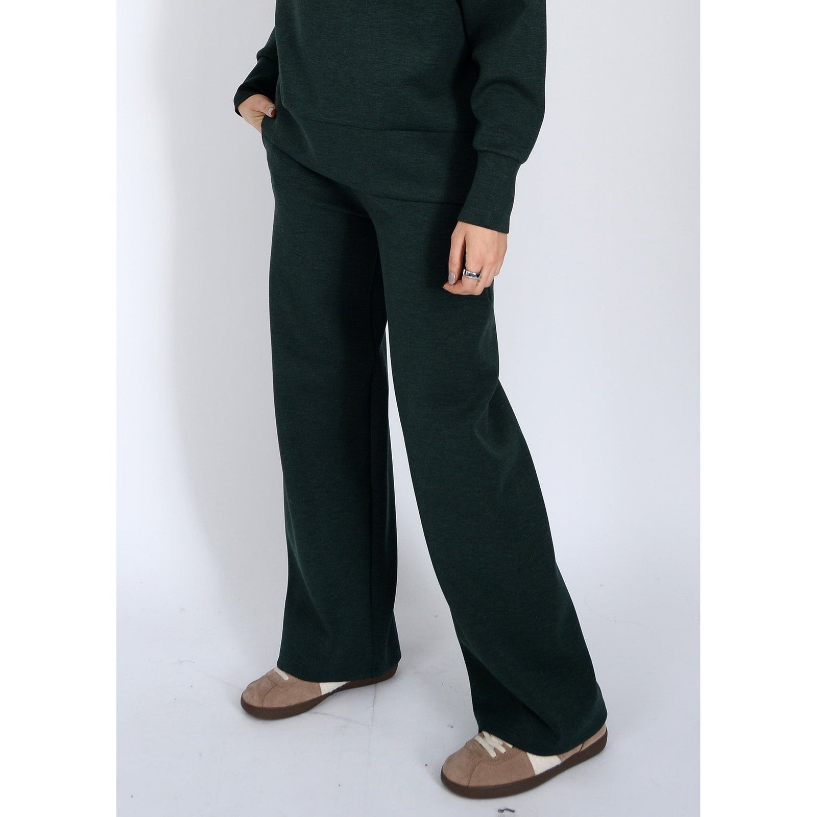 Prida Soft Knit Pull-On Drawstring Pant by Scuba Victoria on a model in dark knit pants.