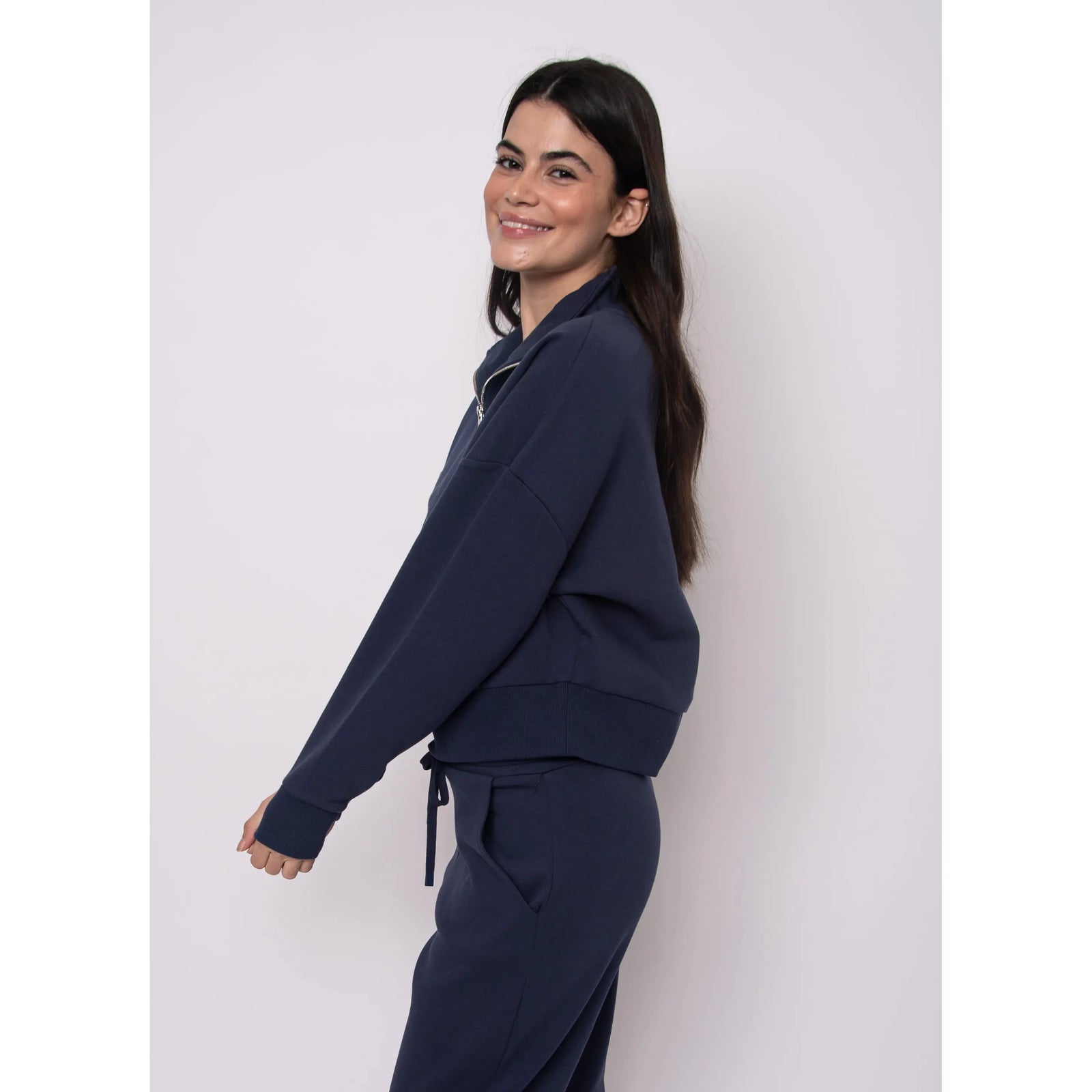 Seanni Soft Knit Half Zip Pullover in navy worn by a smiling model, fall-ready cozy style.