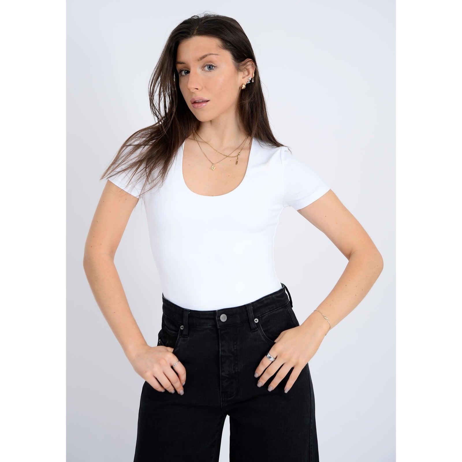 Stylish model showcasing the Second Skin Sue Scoop Cap Sleeve Body Suit by RD Style, perfect for any occasion.