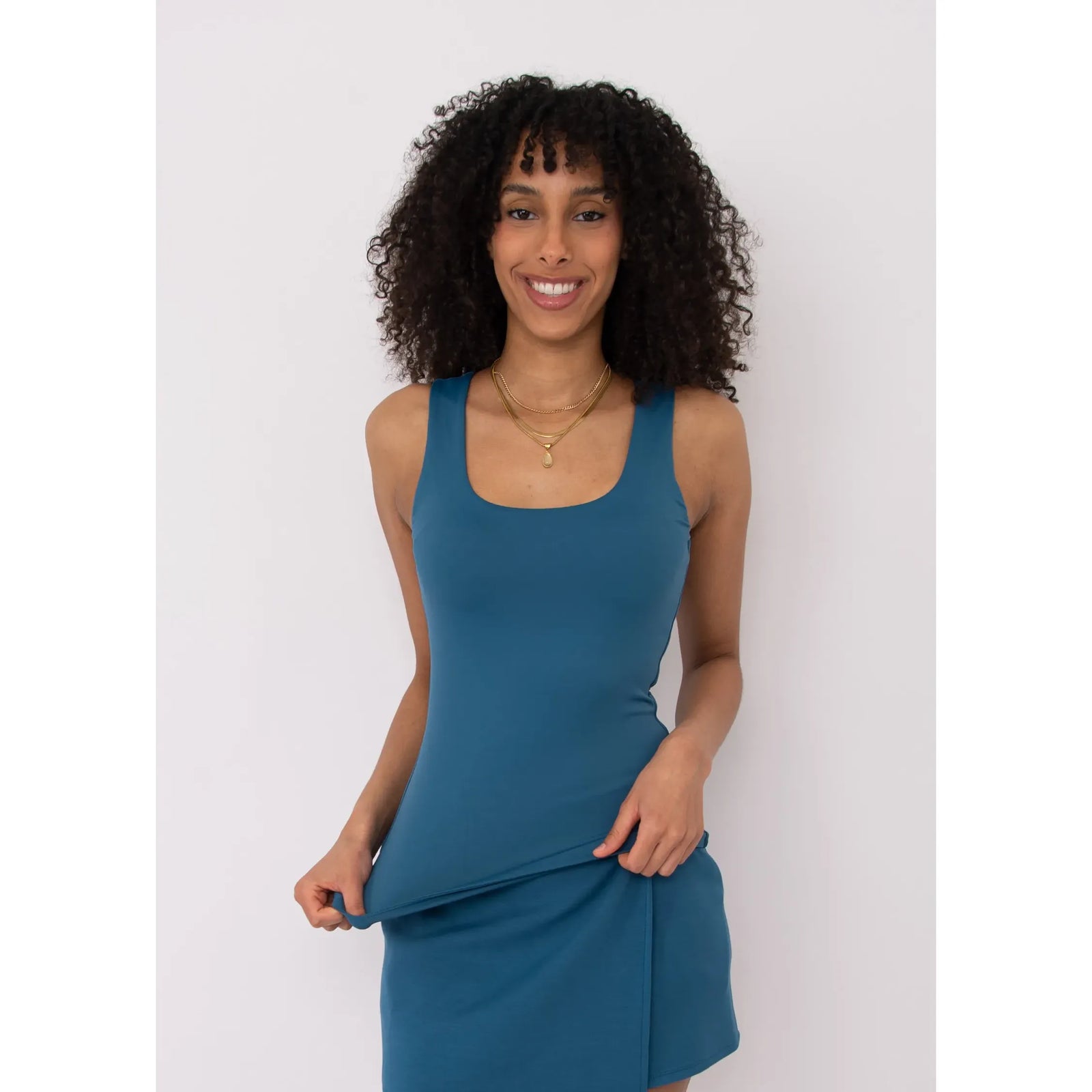 Model wearing Second Skin Tanith Double Uneck Tank Top in blue.