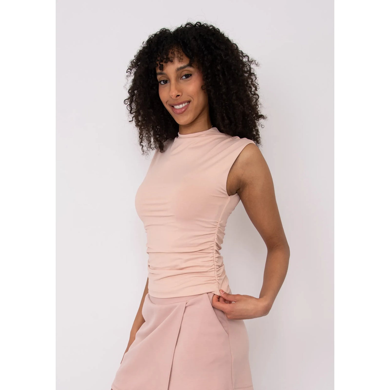Second Skin Yve Ruched Mock Neck tank in blush pink, worn by model.