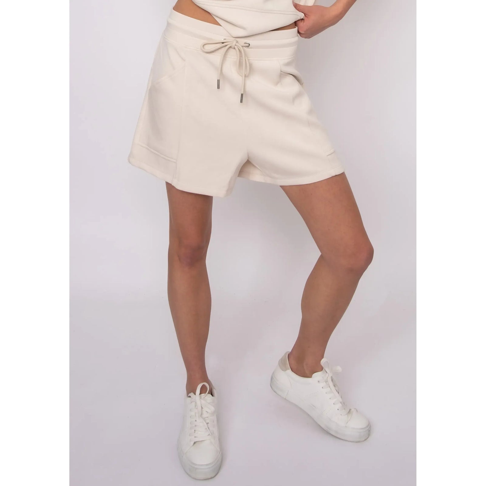 Senza Soft Knit Shorts in beige with drawstring waist and pockets, ultra-soft knit fabric, worn by Sharlen.