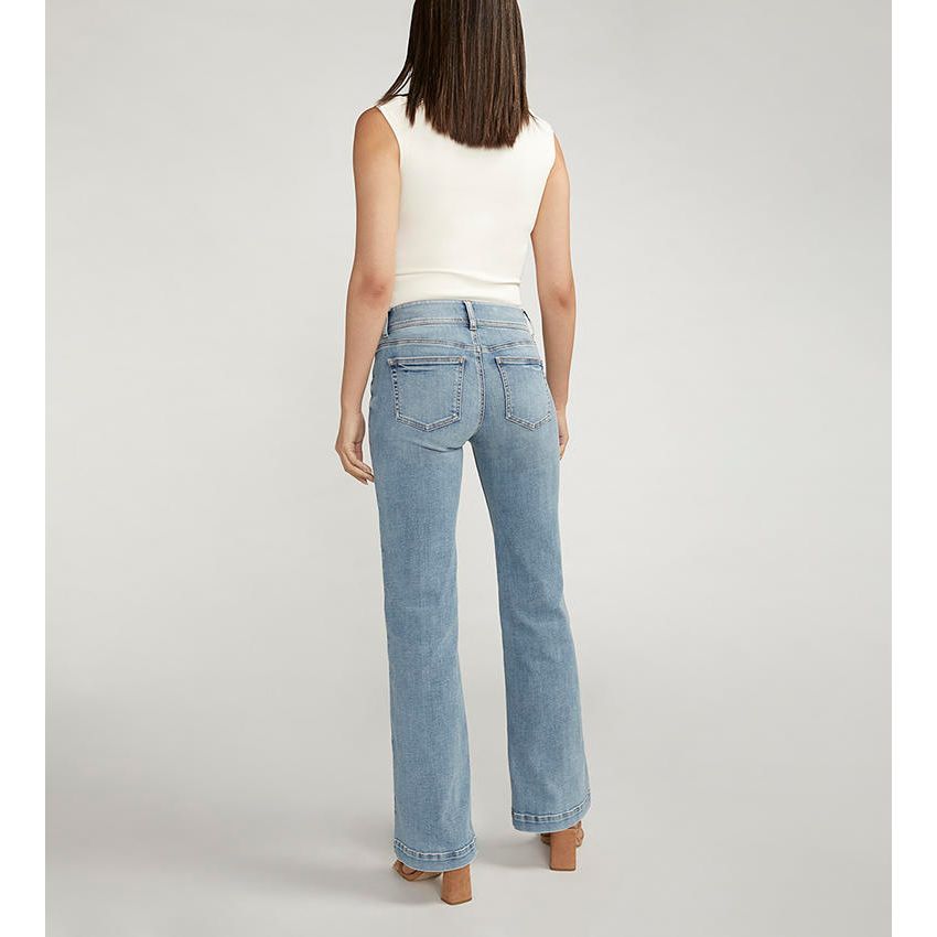 Silver Suki Trouser in Indigo, back view of model wearing power-stretch denim with classic back pockets.