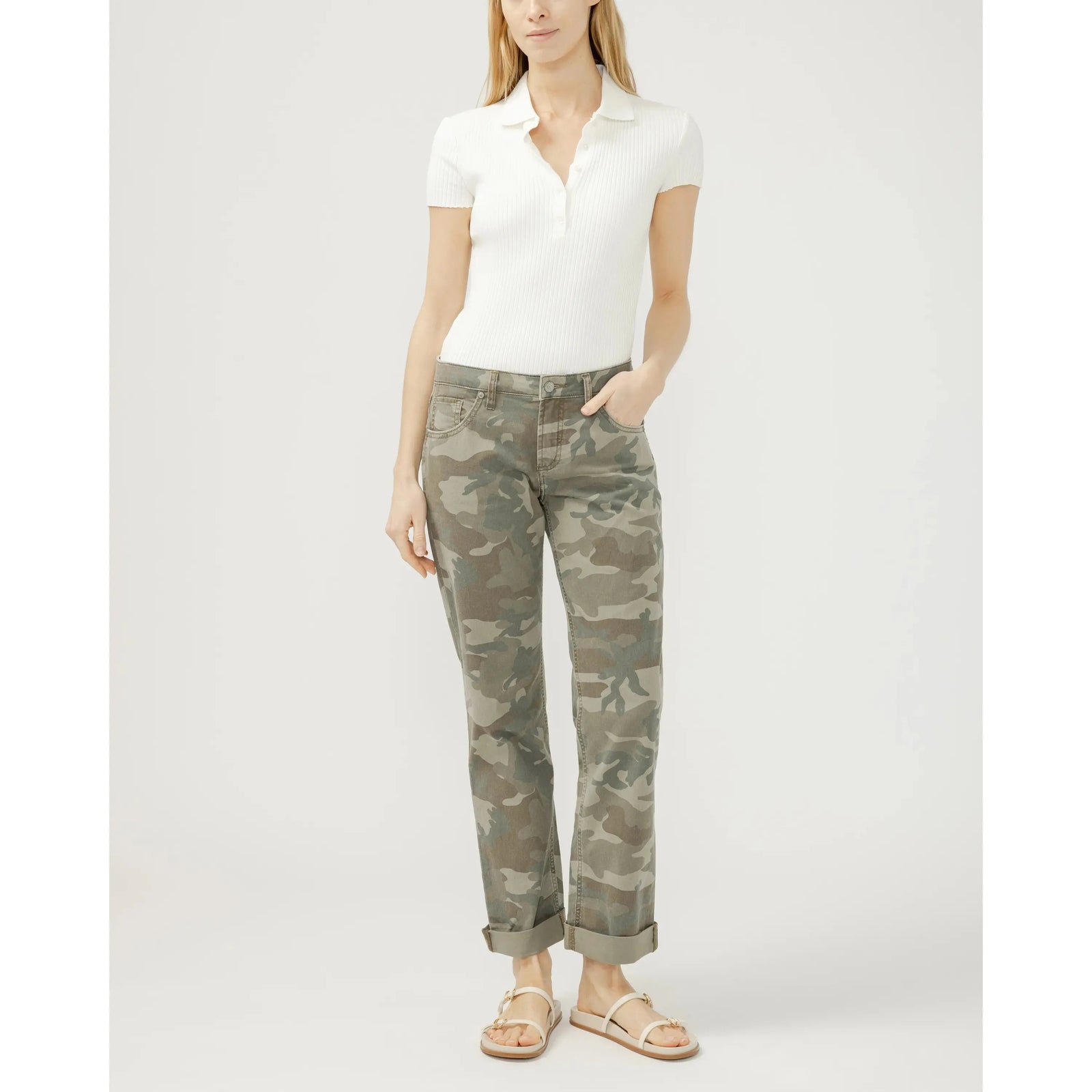 Model wearing Silver Chelsea Boyfriend jeans in camo with cuffed hems and a white ribbed polo.