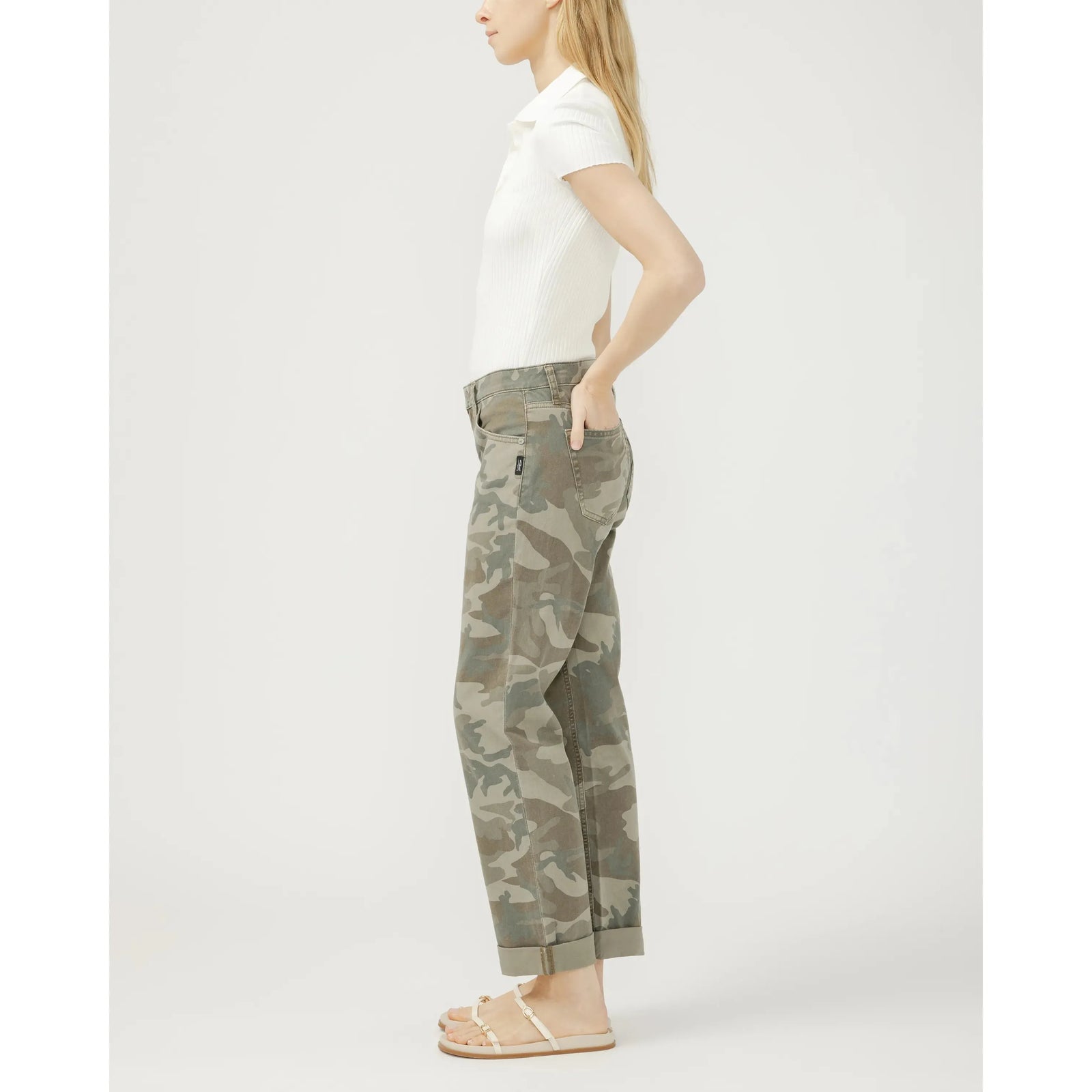 Side view of a model wearing Silver Chelsea Boyfriend in Camo jeans with mid-rise, straight leg, cuffed hem.