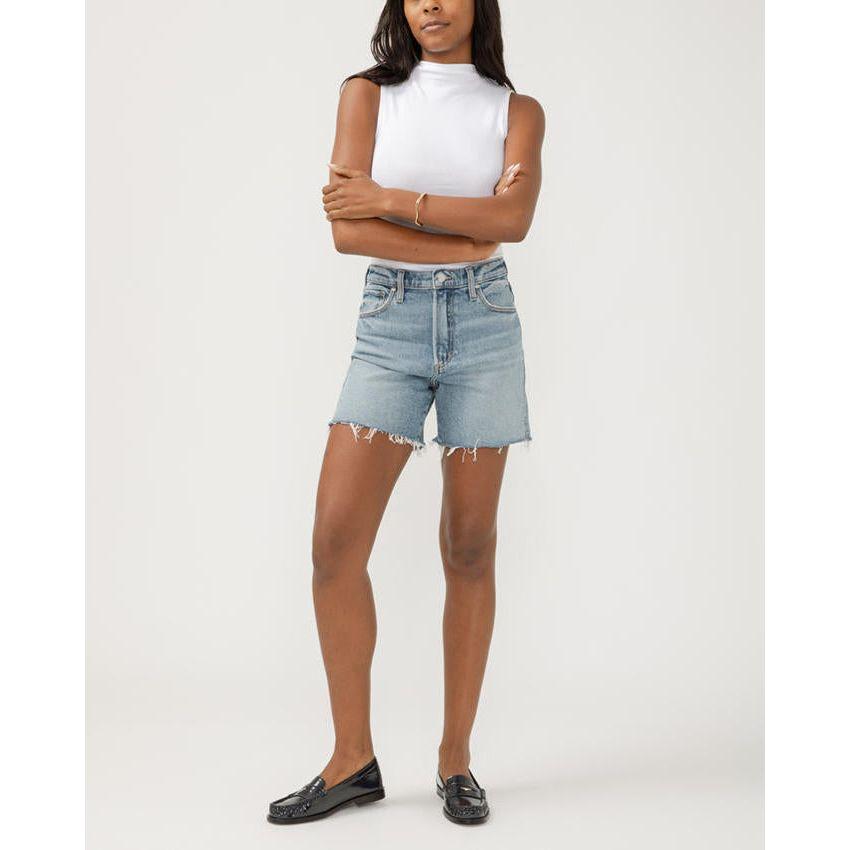 Stylish model showcases Silver Highly Desirable Long Shorts by Silver Jeans Co.™, perfect for a trendy look.