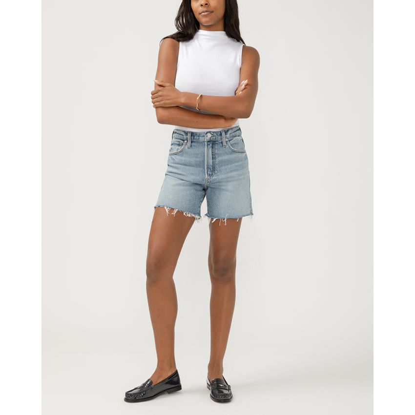 Stylish model showcases Silver Highly Desirable Long Shorts by Silver Jeans Co.™, perfect for a trendy look.