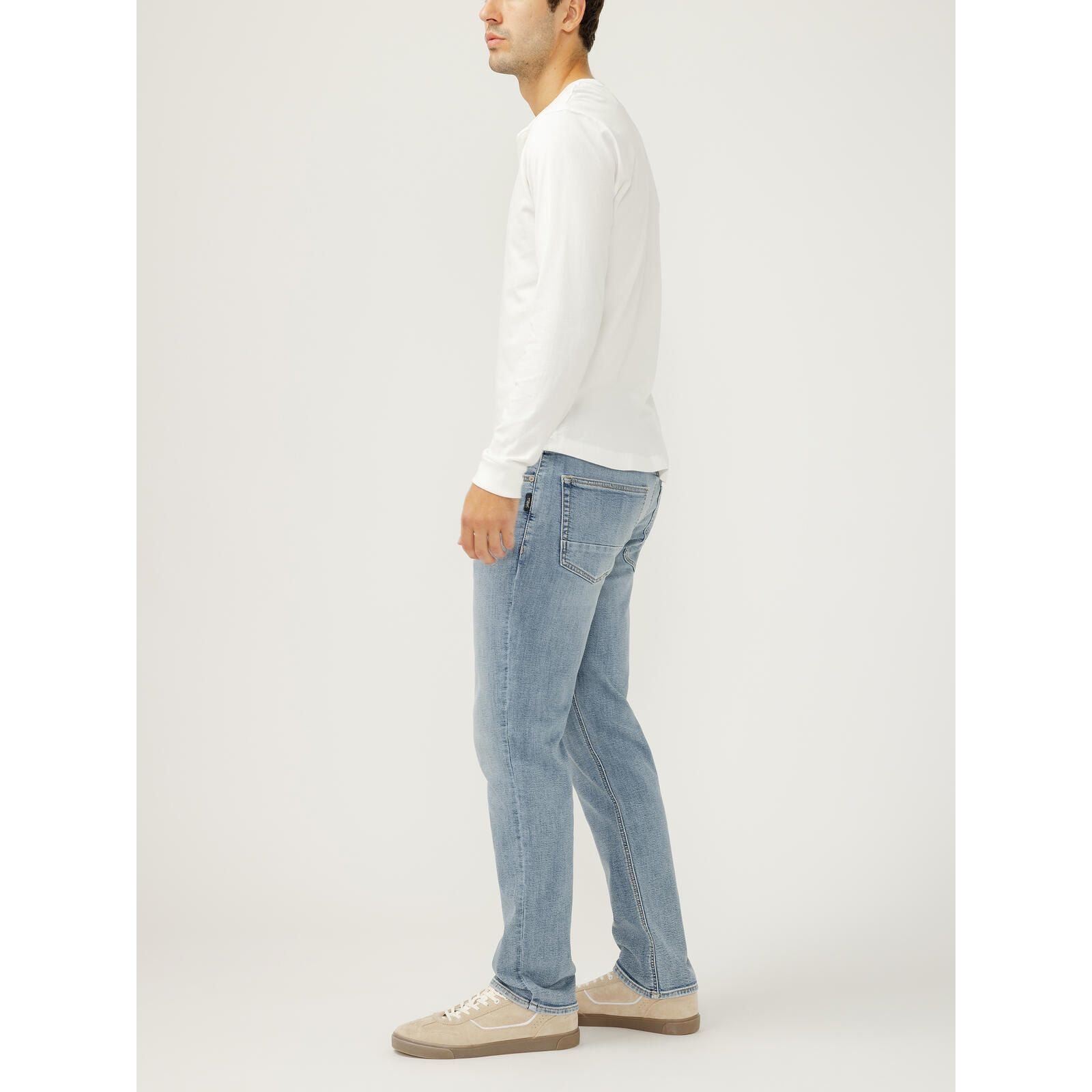 Silver Machray slim straight leg jeans in Wild on a man wearing a white long-sleeve shirt and light denim